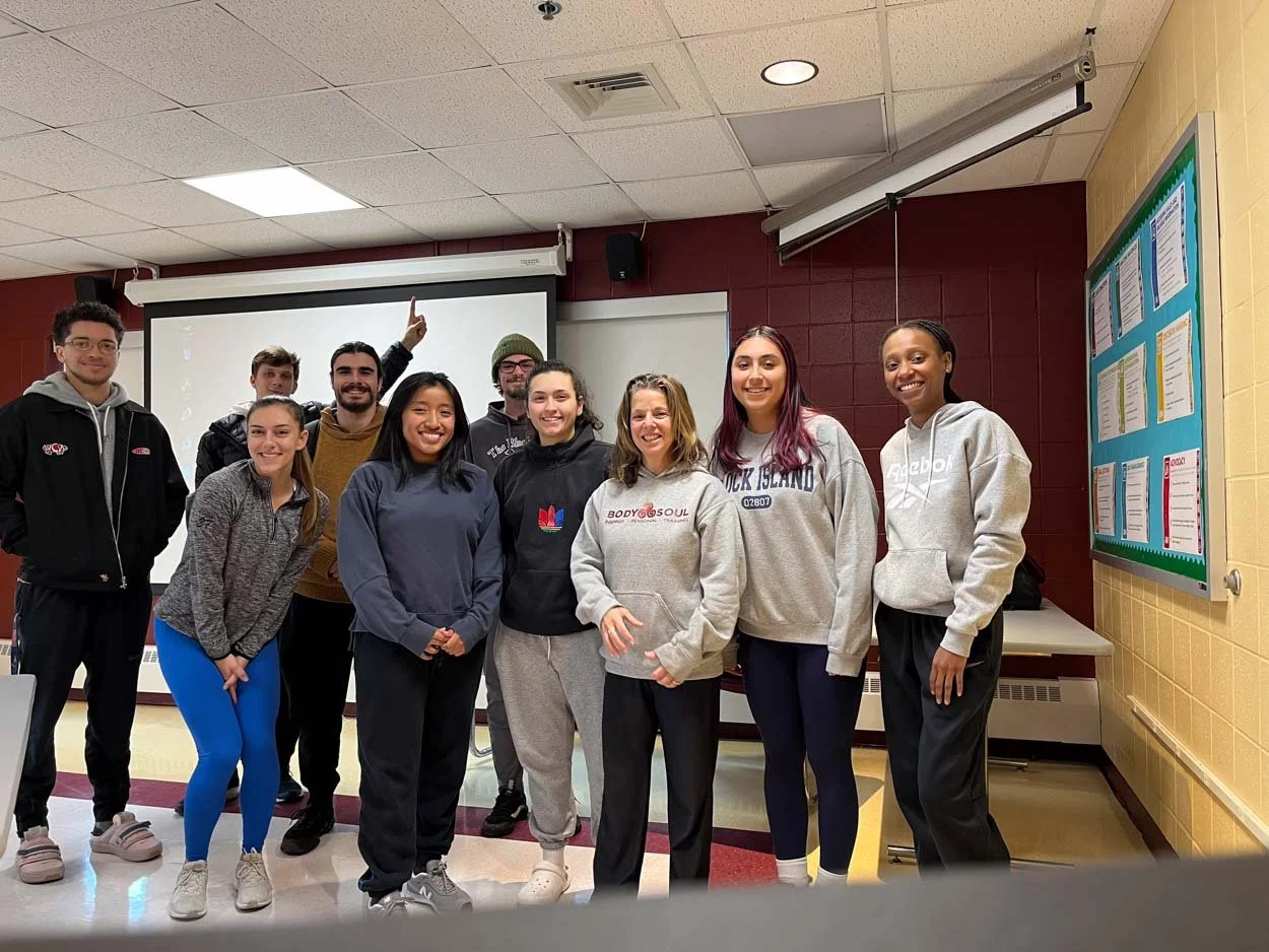 Lisa Cournoyer Murphy with Rhode Island College students during a health and fitness education program.