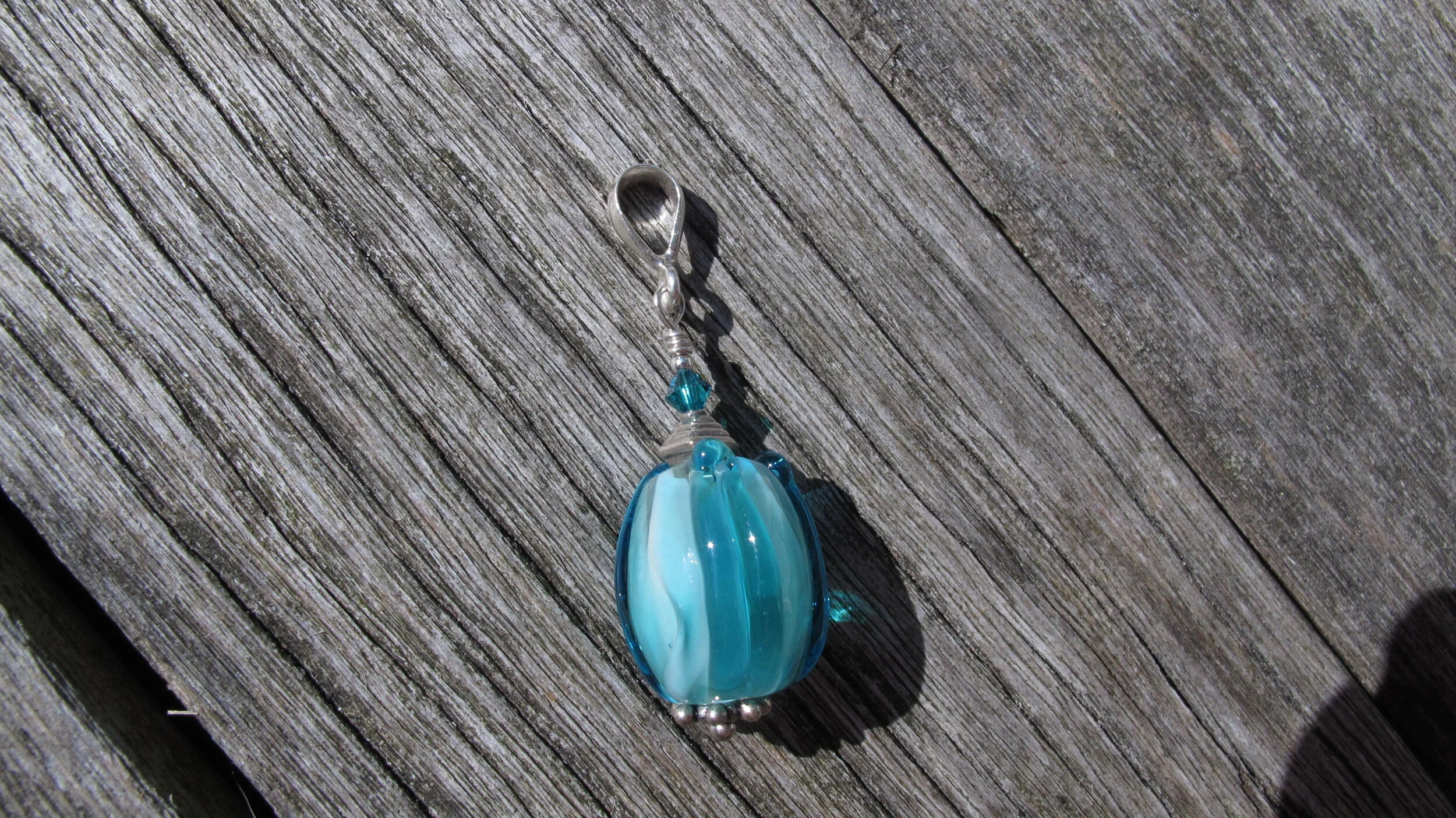 Lt Aqua Tulip Pendant on deck.JPG