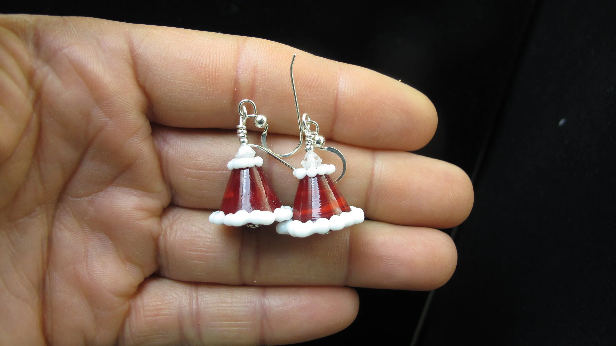 Santa hat on hand.JPG