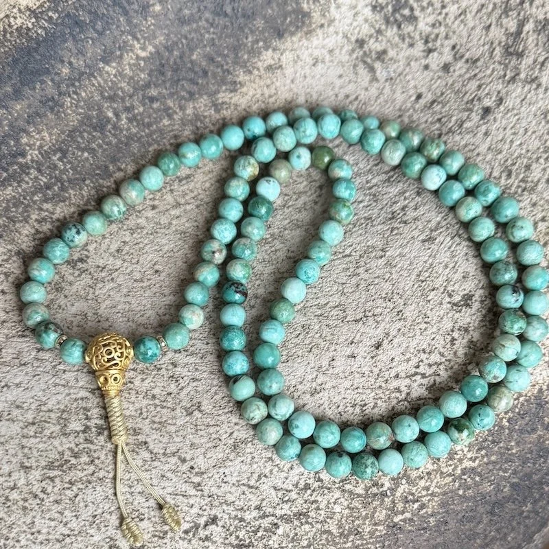 Turquoise meditation mala with mahakala knot.JPG