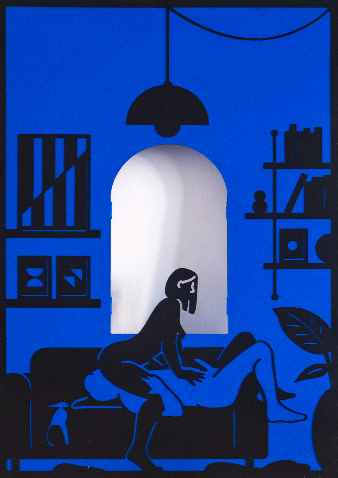 Double-sided paper cut frame depicting a woman at the window and an intimate scene inside.