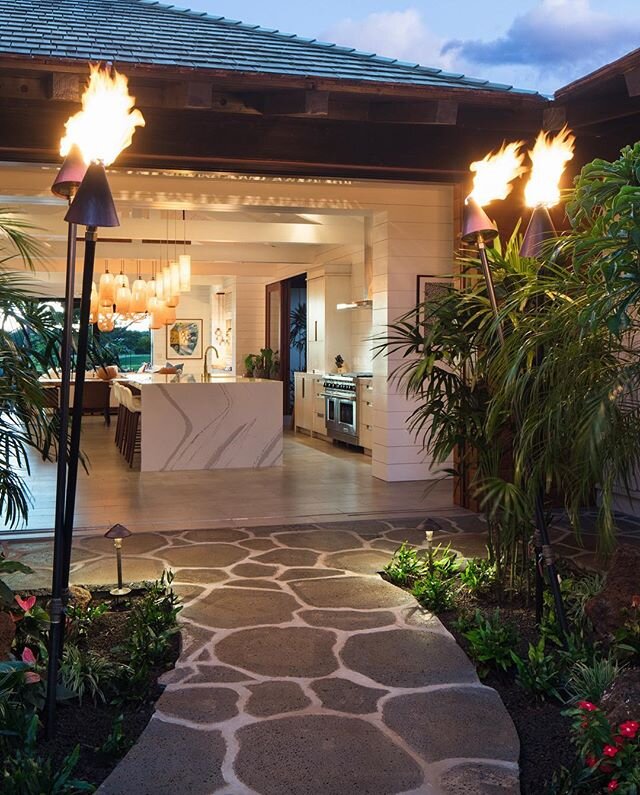 Tiki torches line the way in this beautiful tropical garden courtyard!
