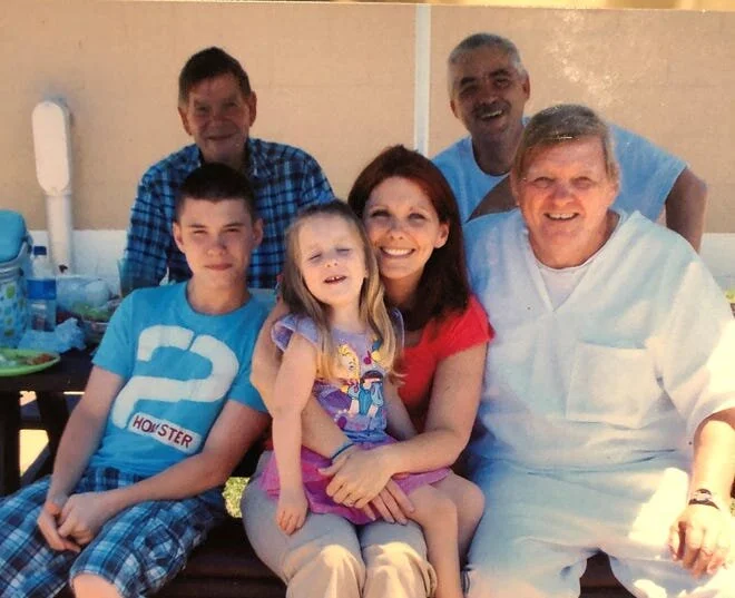 Jackie Ray Lovett (front right) poses with family members, courtesy of Shannon Perdue, by way of Delaware News Journal.