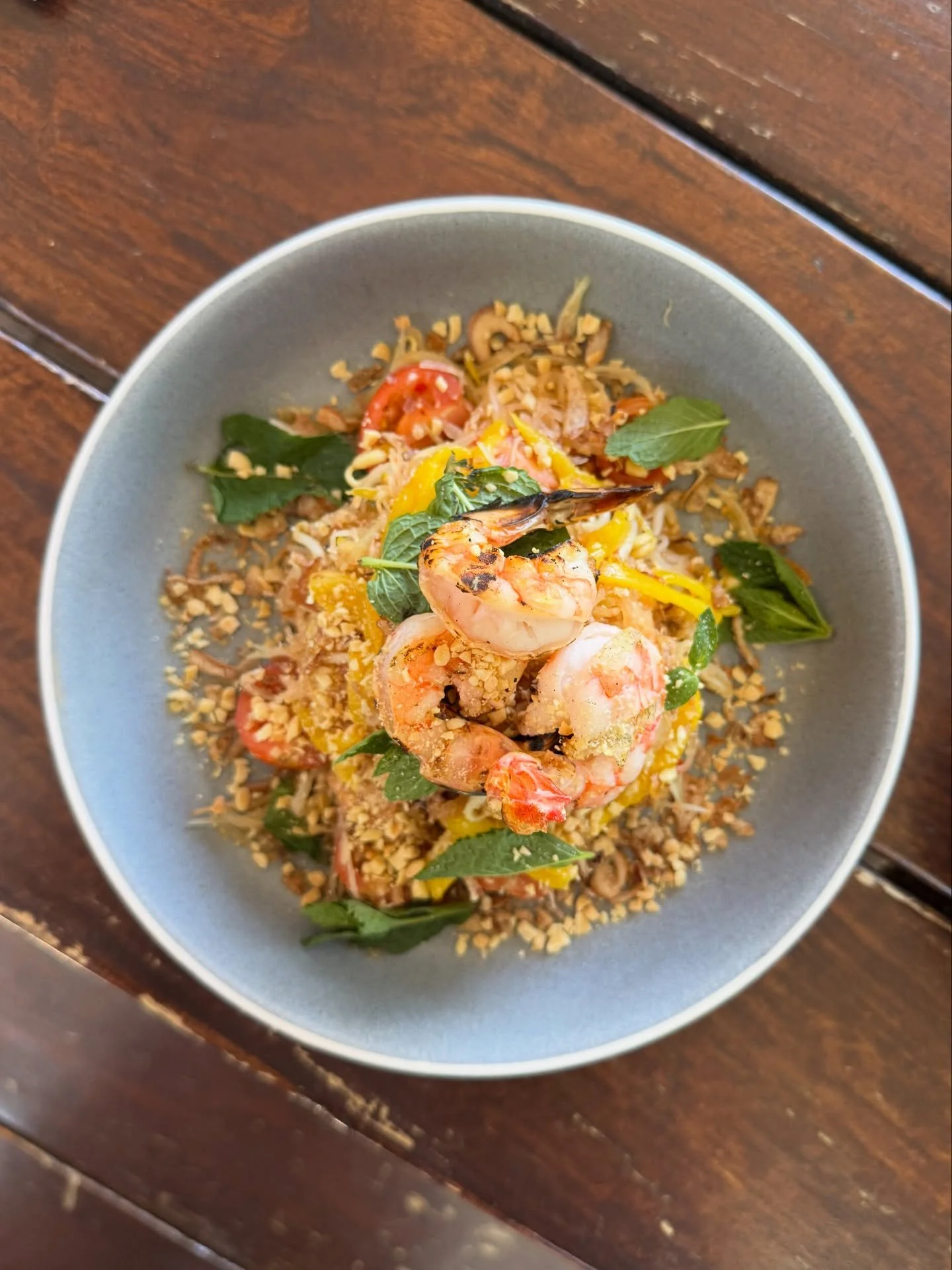 Eating cleaner in 2026? Check out our papaya salad, loaded with prawns, cherry tomato, crispy shallots, bean sprouts, peanuts and nam jim. 😍