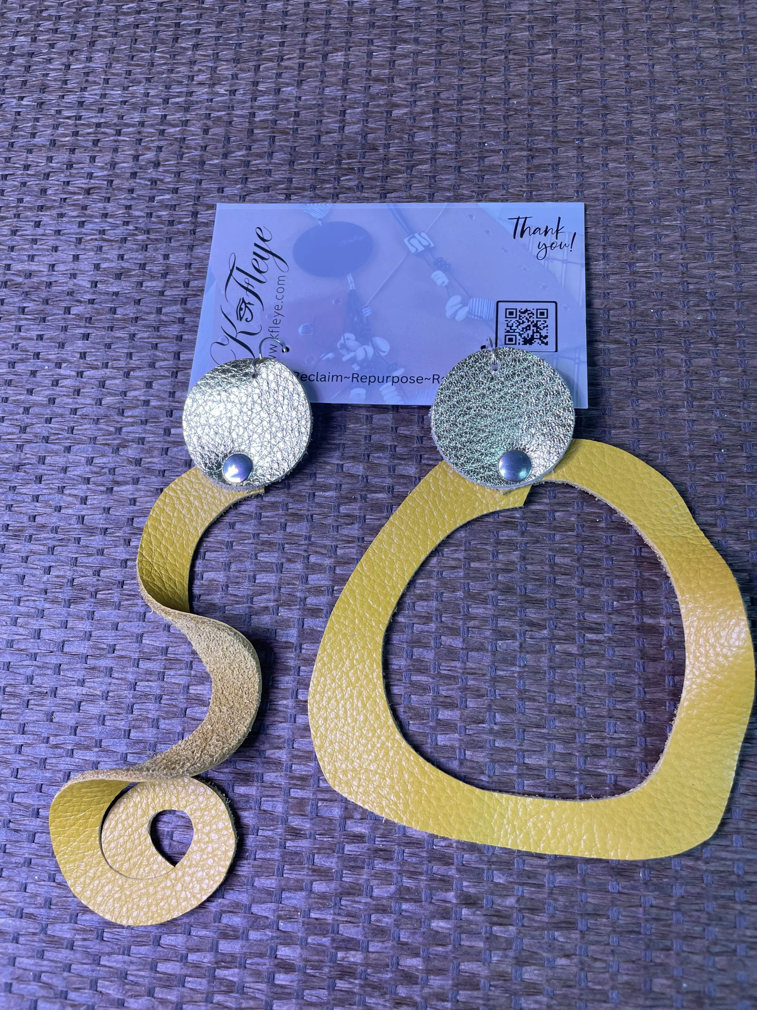 be light Dandy and metallic yellow earrings