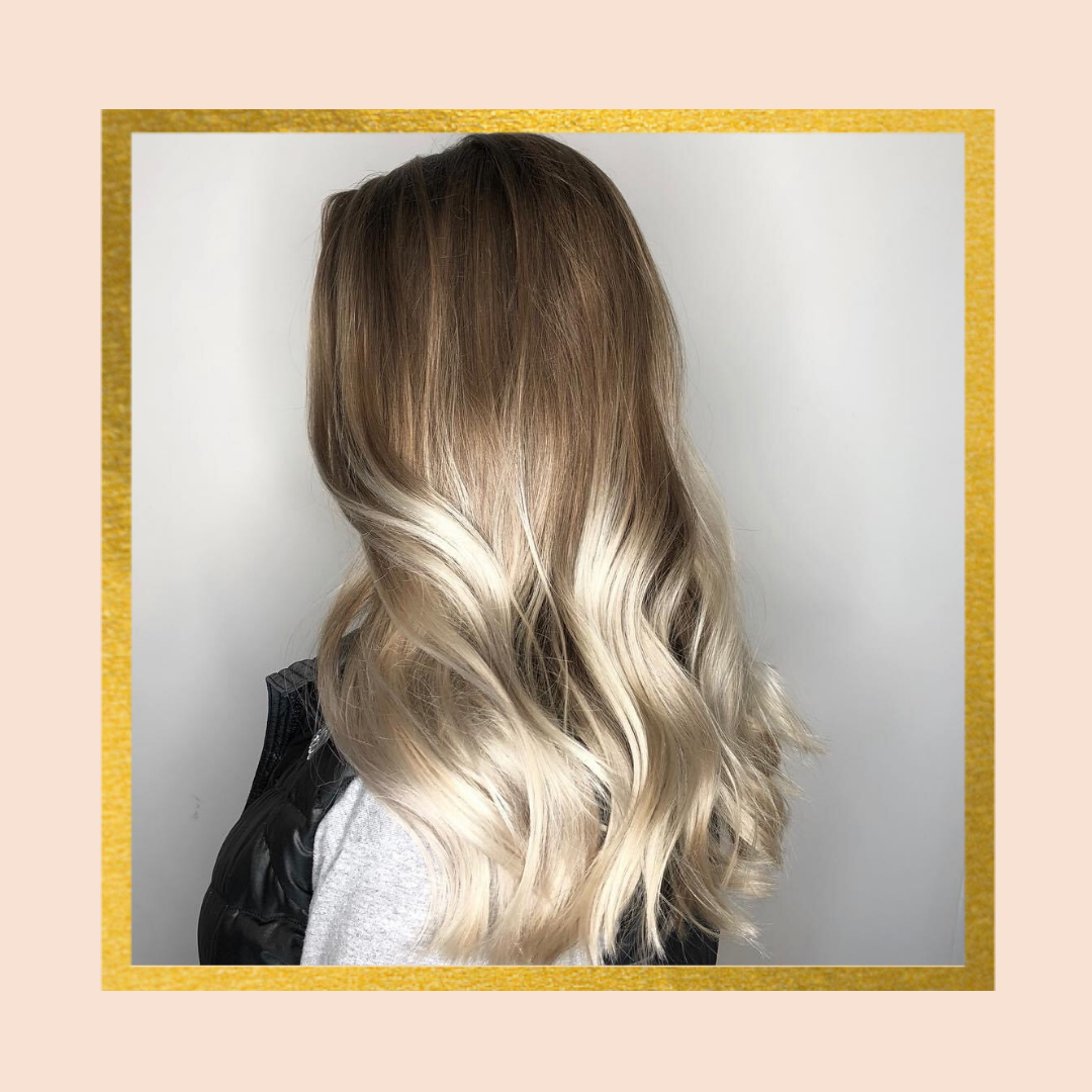 Woman with wavy blond balayage hair