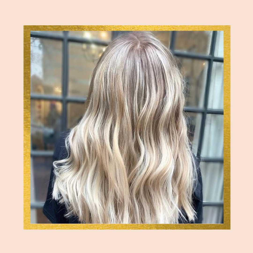 Blonde hair with wavy highlights, back view.