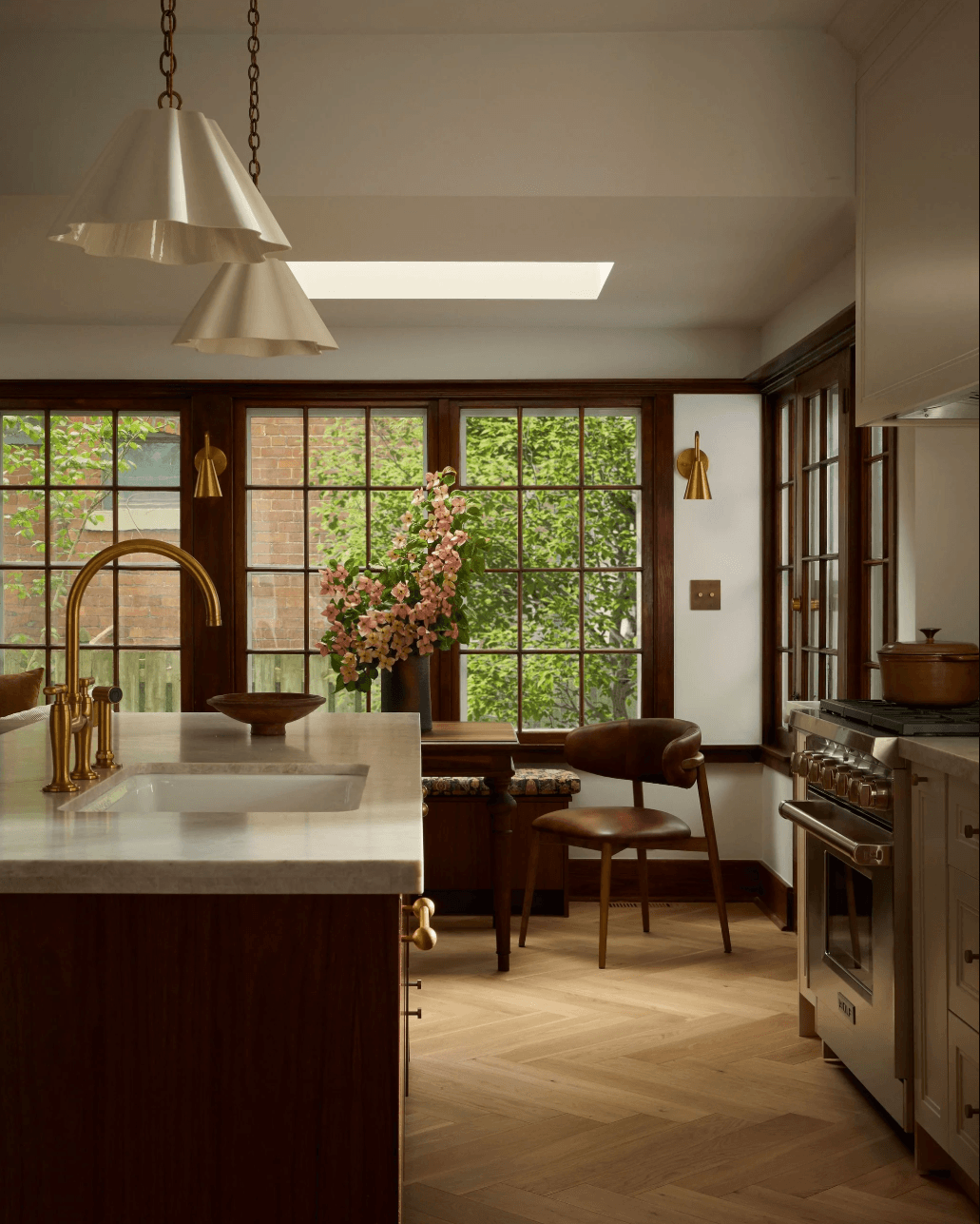 transitional-kitchen-design-dark-wood-island-brass-accents.png