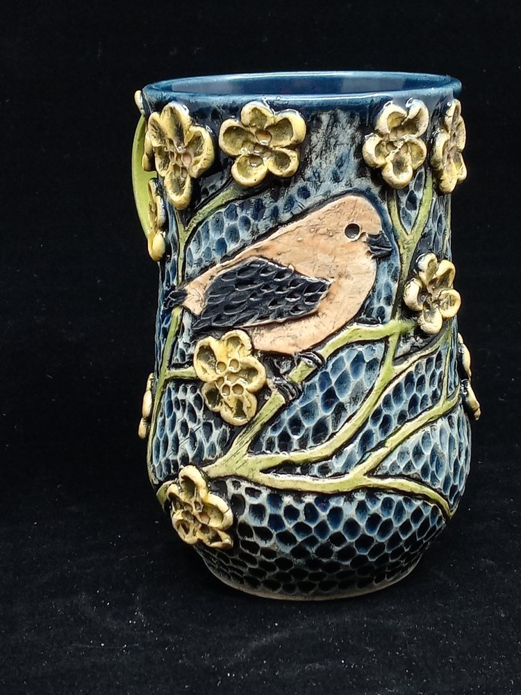 Blue Carved Mug with Yellow Bird and Flowers.jpeg