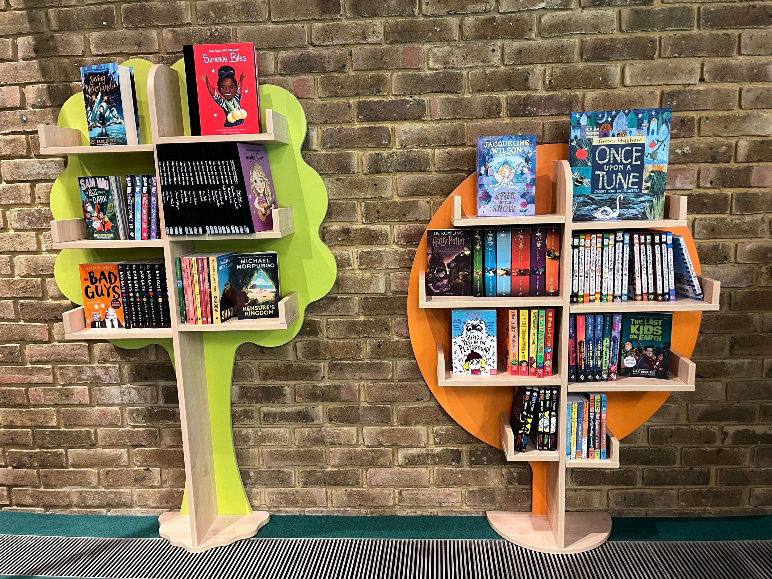 Books Trees in a primary school library stocked by Chestnut Books. Graphic Novels and popular chapter books provided at competitive prices. 