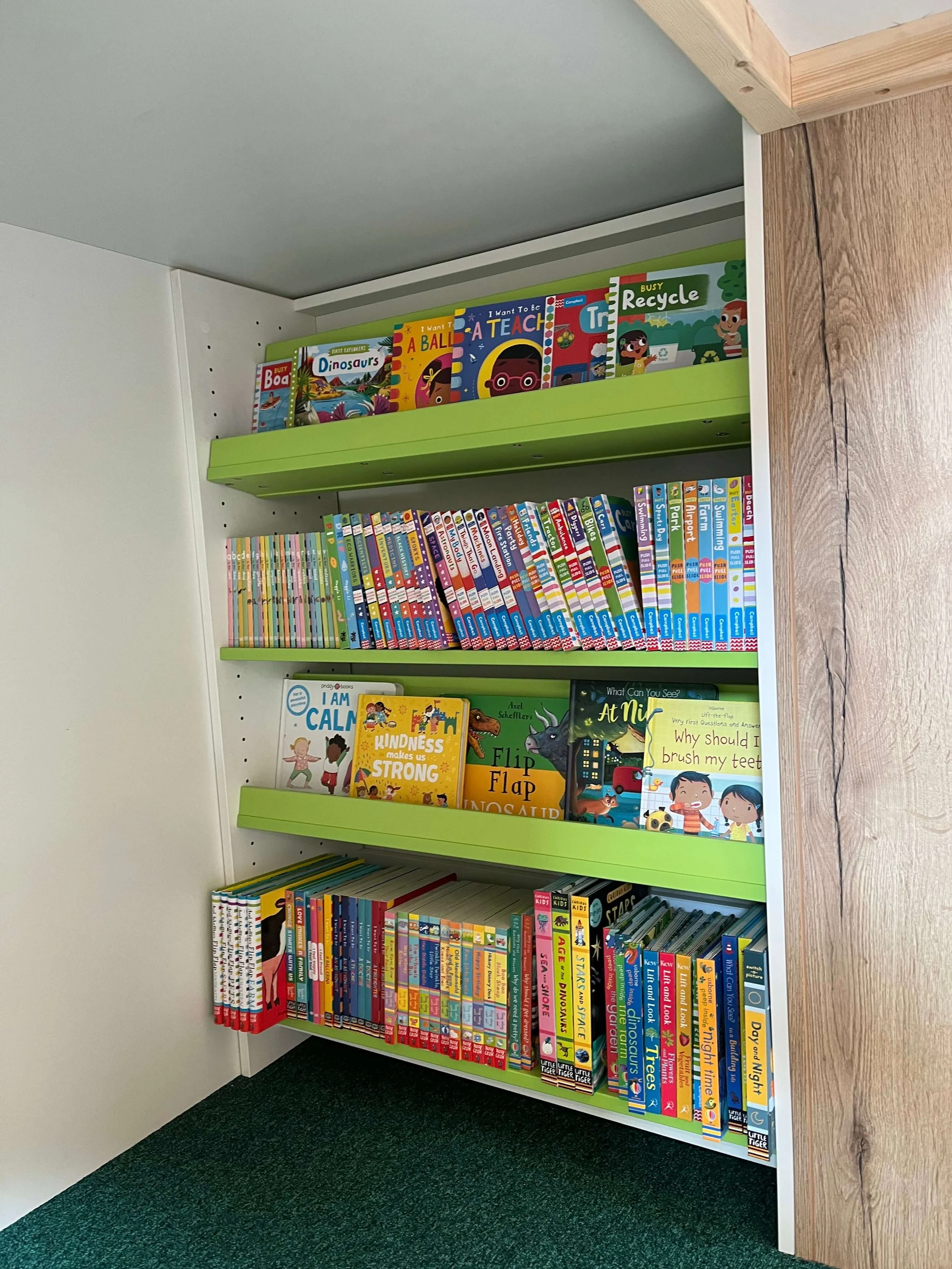 A reading nook at a brand new school library in Derbyshire. Board books to encourage a love for reading in the school's nursery. High quality, modern and diverse books provided at competitive prices by Chestnut Books.