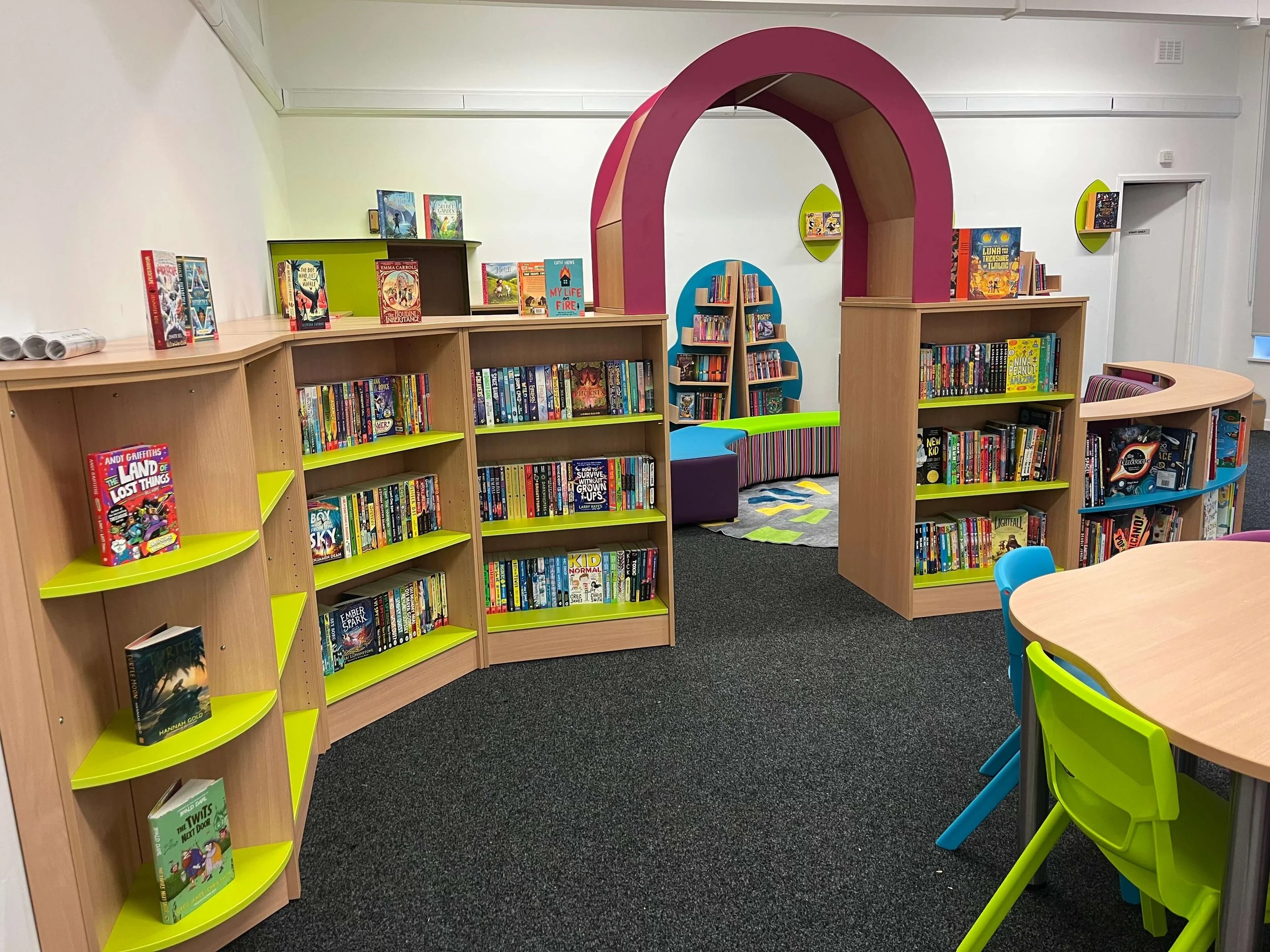 Entrance to welcoming primary school library stocked by Chestnut Books. Exciting chapter books chosen to inspire a love for reading. 