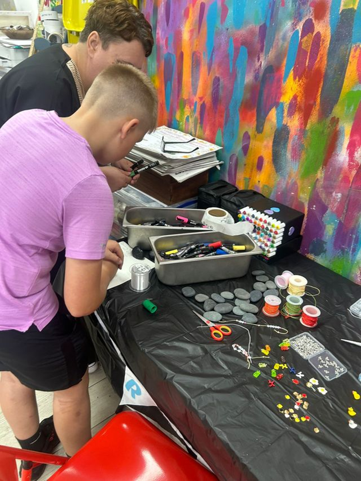 Adsbridge Youth Connection participant getting involved in arts & crafts
