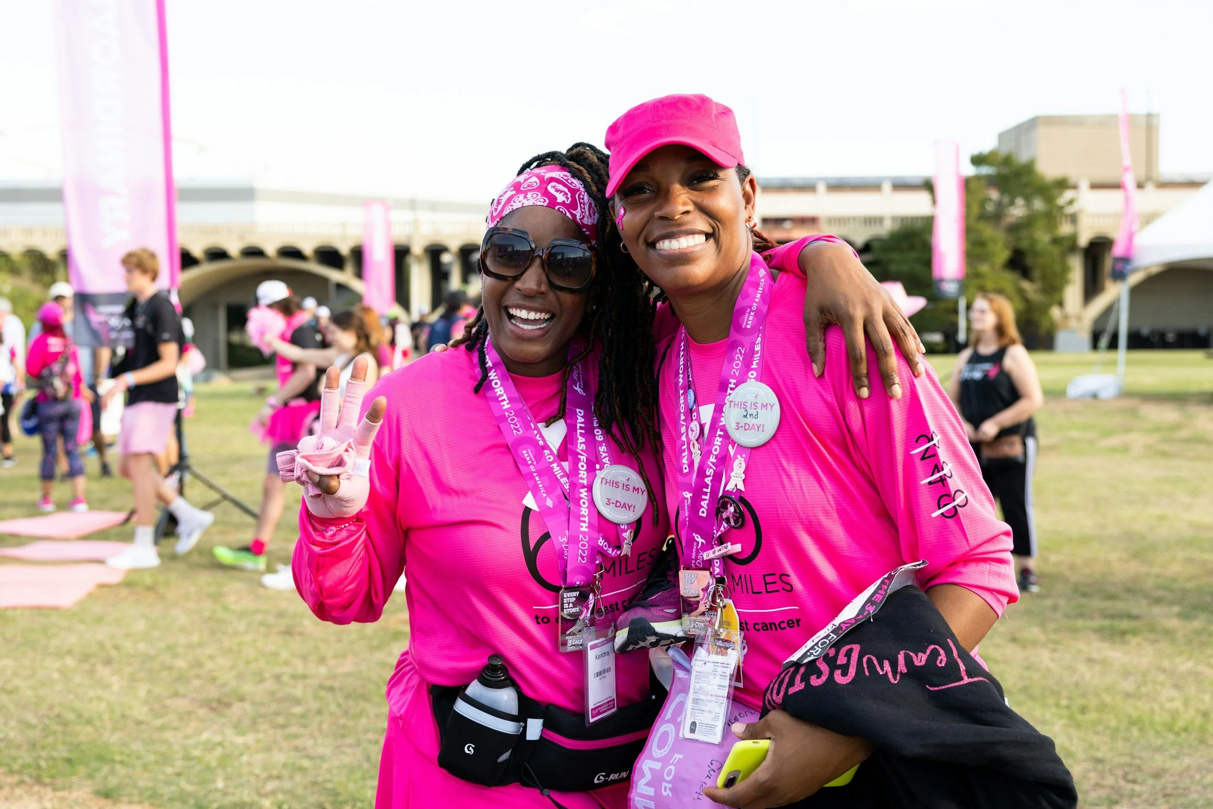 Two women pose for the camera having run a charity race.