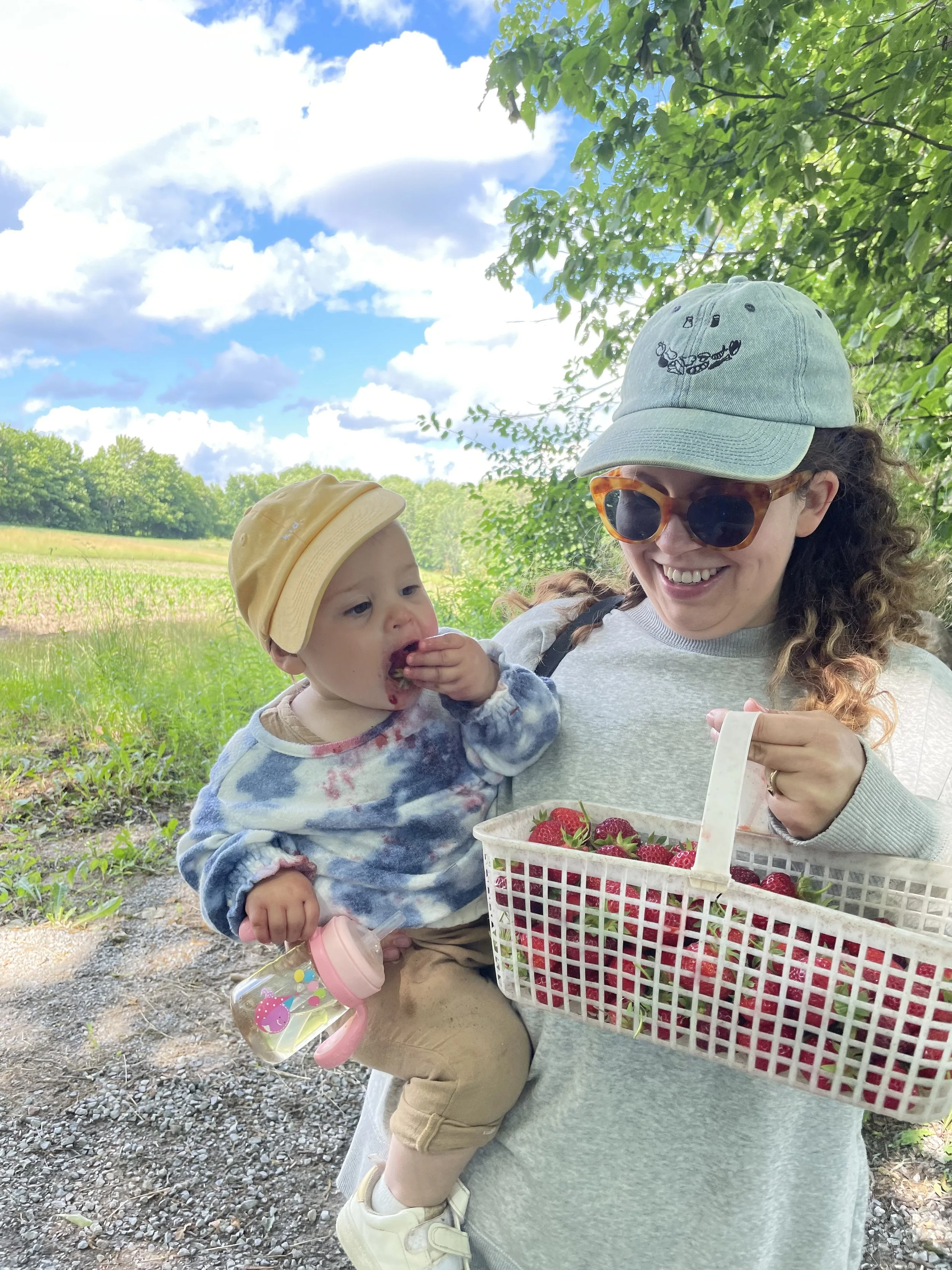 Mary and Clementine picking Strawberries