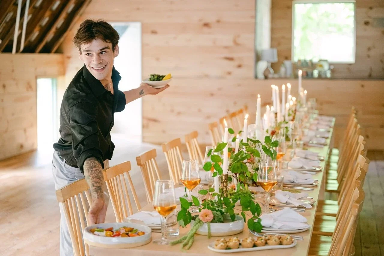 Landon setting a table