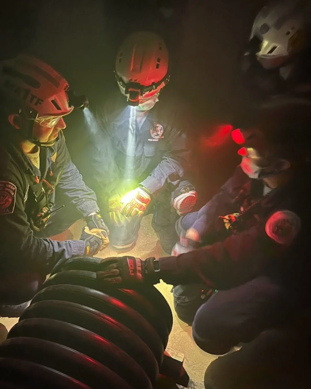 A debrief. After an iteration of Urban Search and Rescue (USAR) training, team members discuss what went well as well as lessons learned. #commitmentservicesacrifice