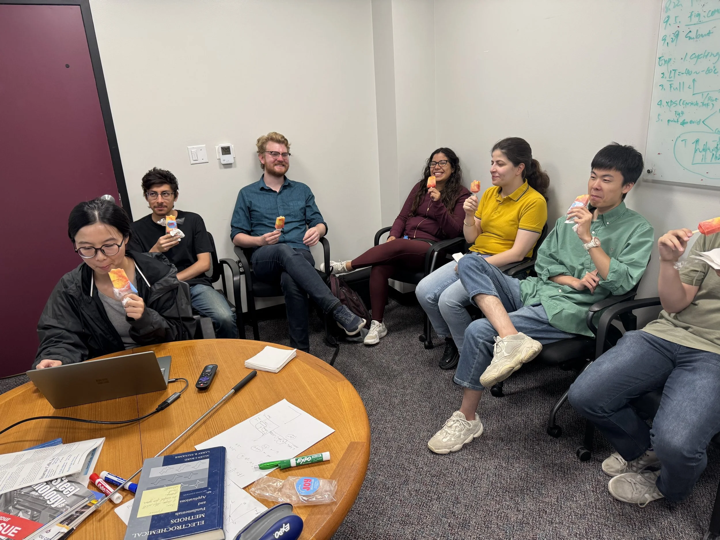 ME2 lab members enjoying the snacks before weekly group seminar!  August 2025