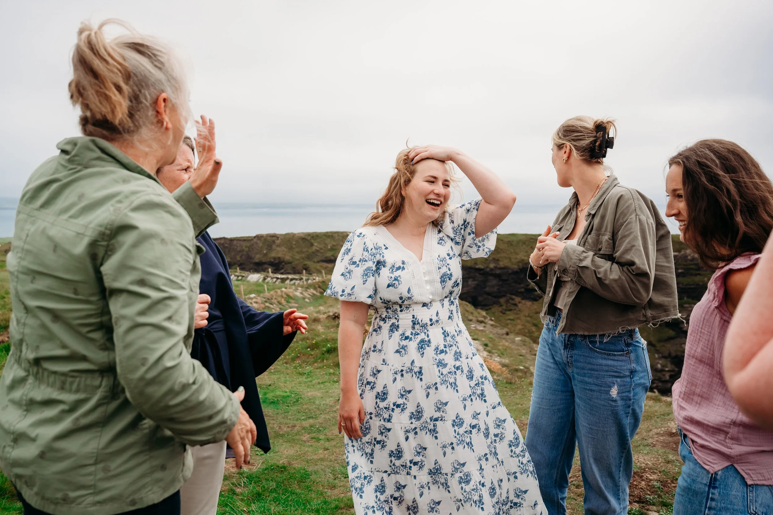 family congratulations surprised girl Cliffs of Moher Hags Liscannor proposal photographer Ireland Co Clare