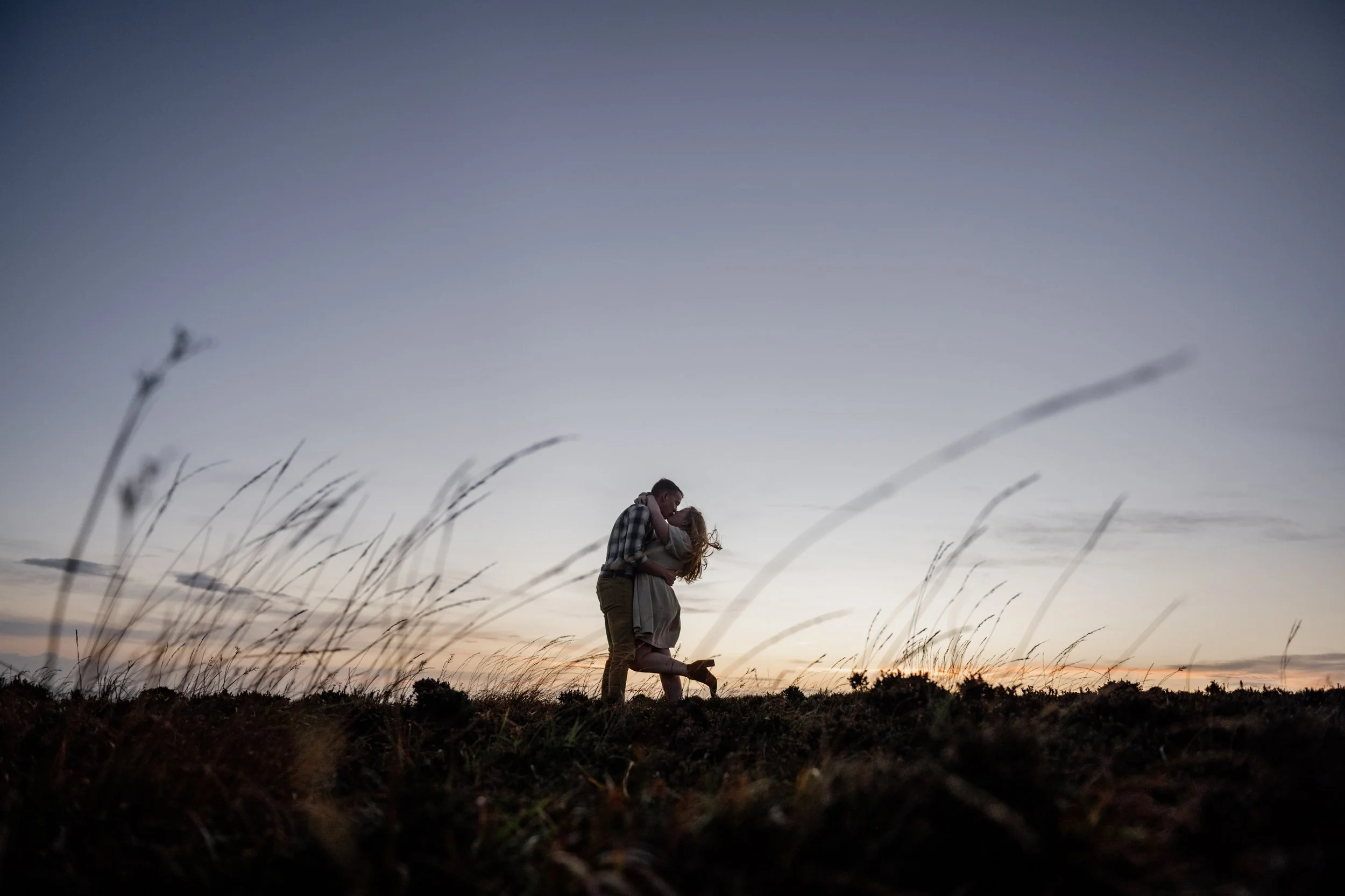 Couples session cliffs of moher at sunset with couple dancing against the sky 