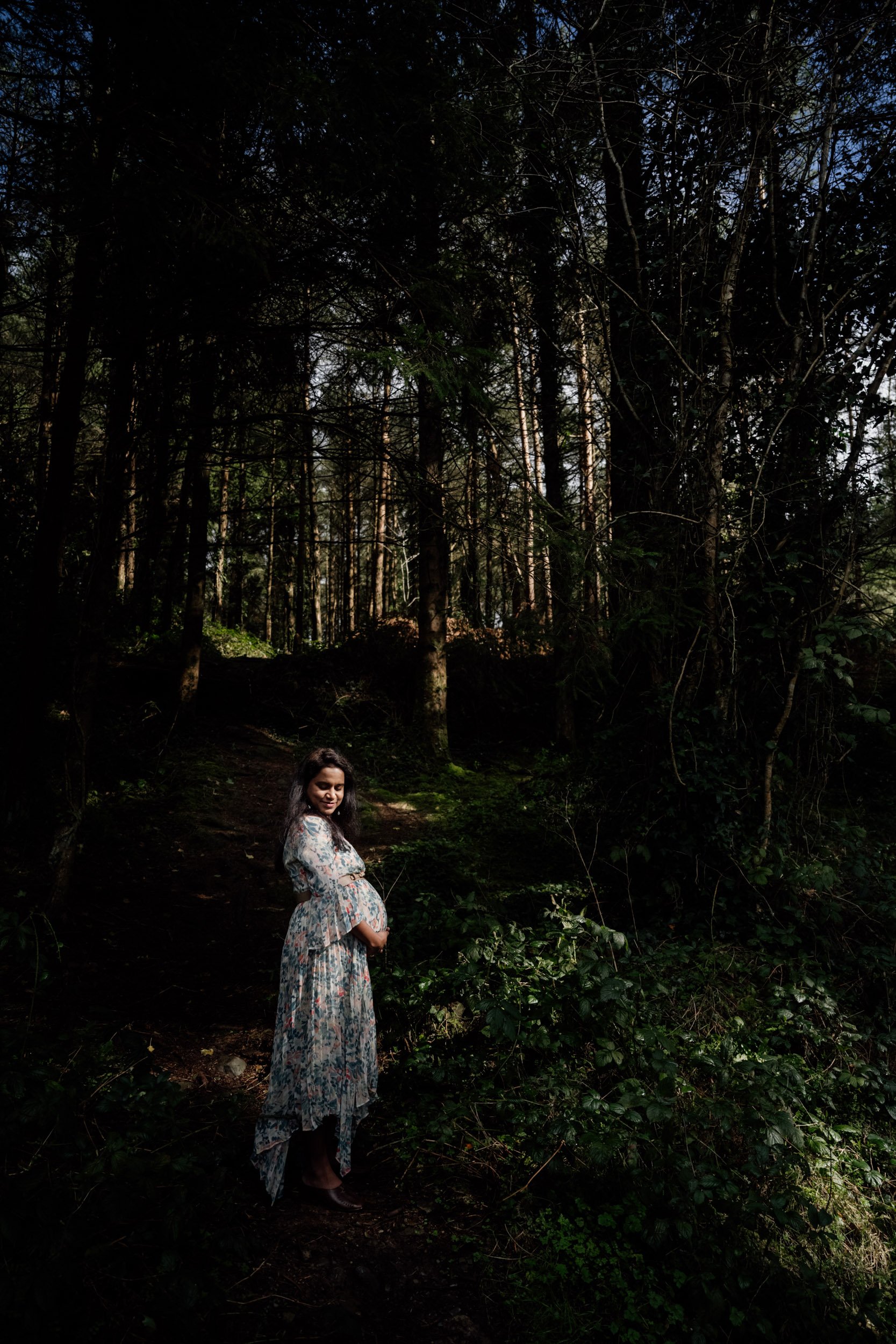 trees with highlight Husband laughing black and white cratloe woods maternity photos Ireland