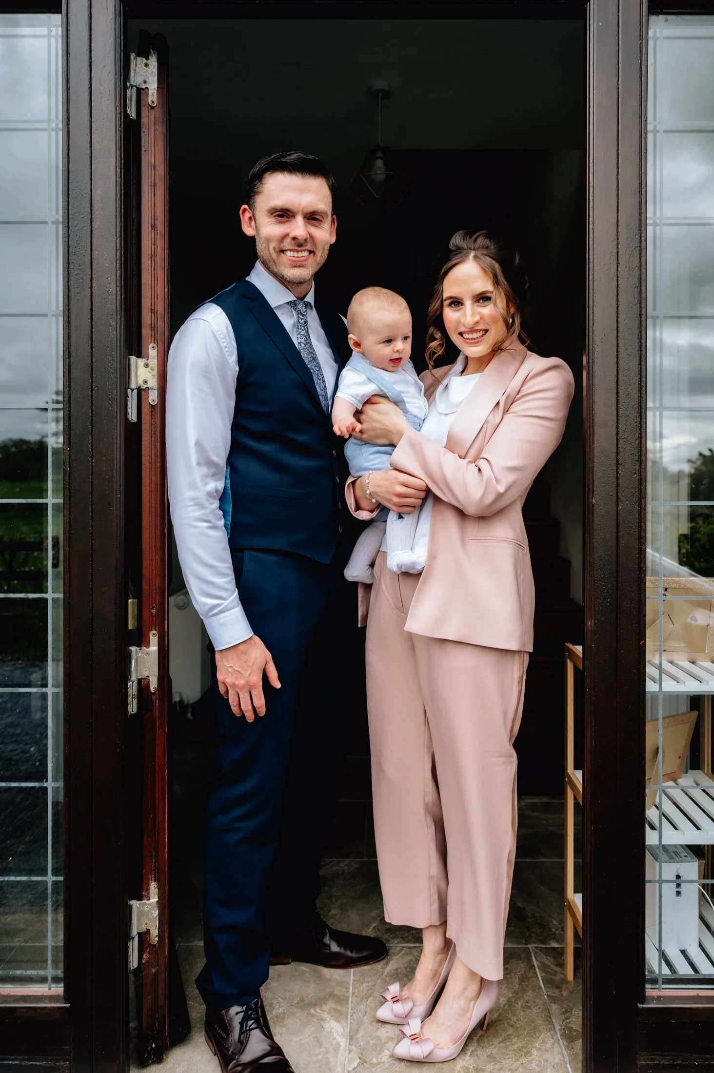 doorway family portrait lifestyle photo session in home christening photos limerick photographer