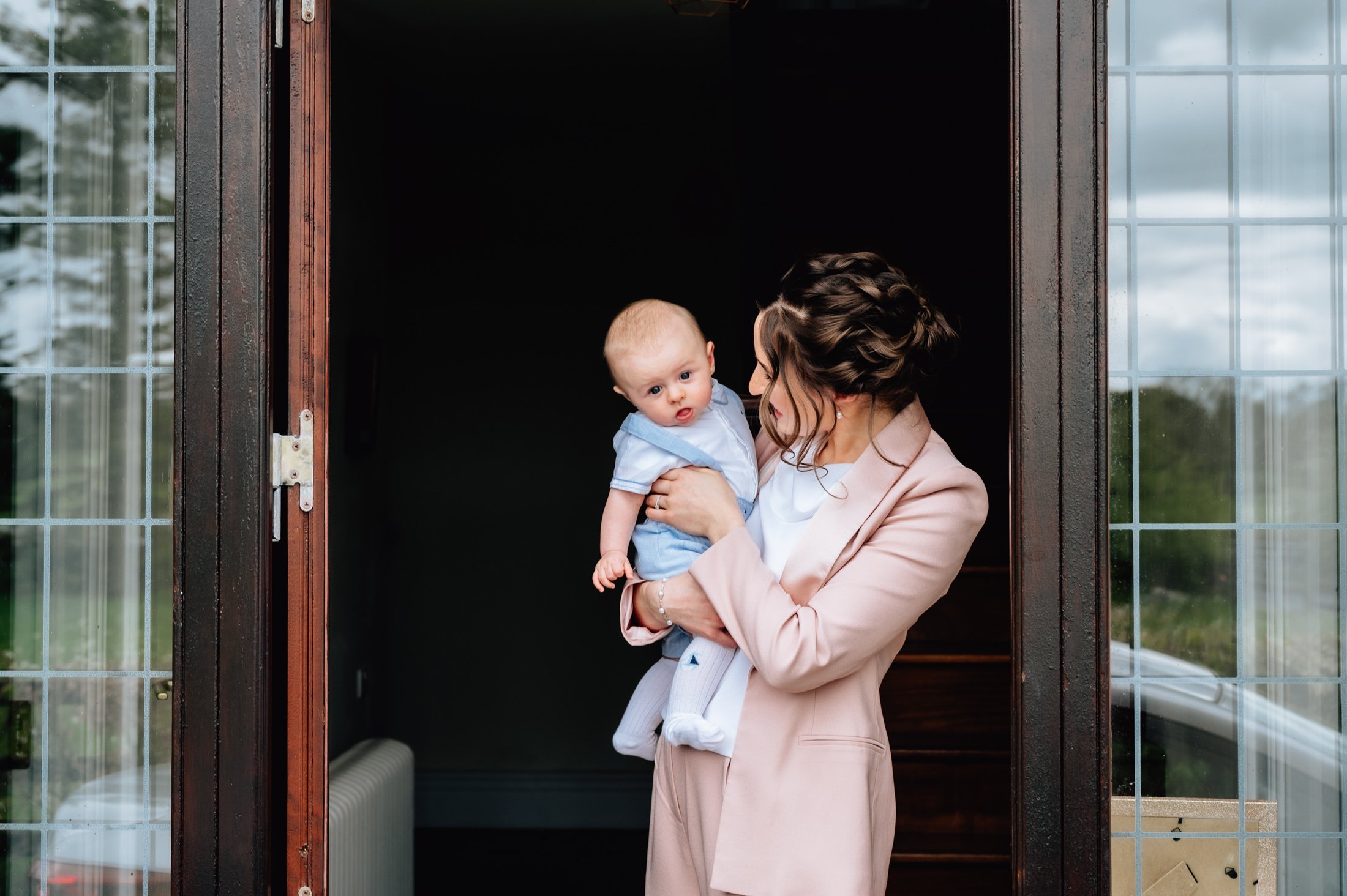 mom and baby boy portrait in doorway christening photos limerick photographer