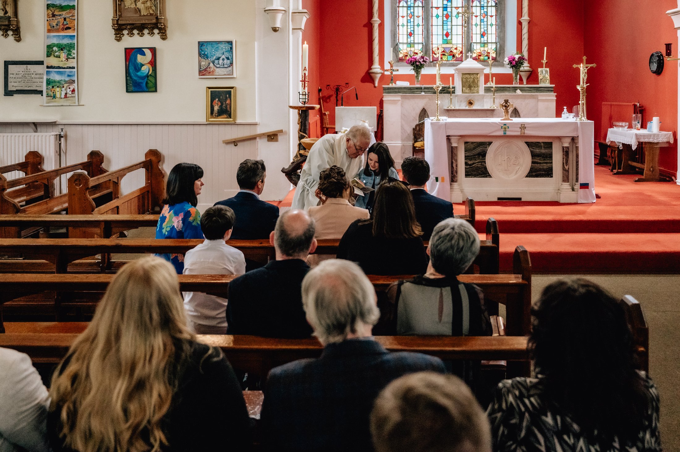 priest during christening photos limerick photographer