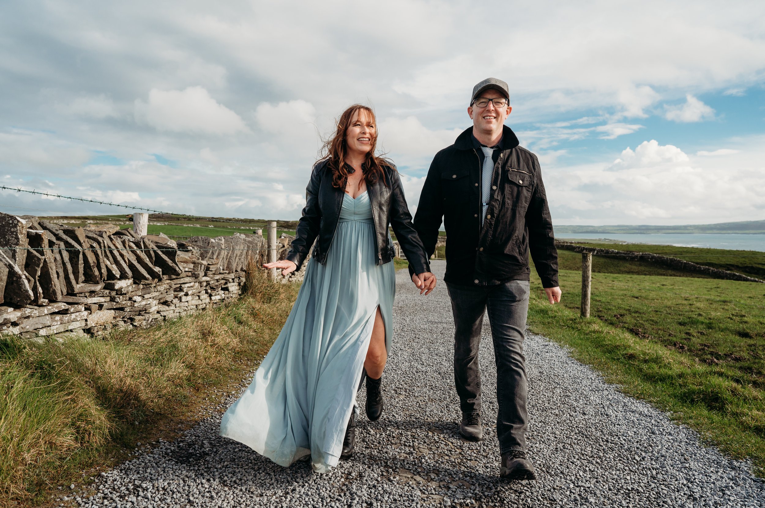 Marie O'Mahony photographer Cliffs of Moher anniversary couples photo session couple walking up path to Hags Head