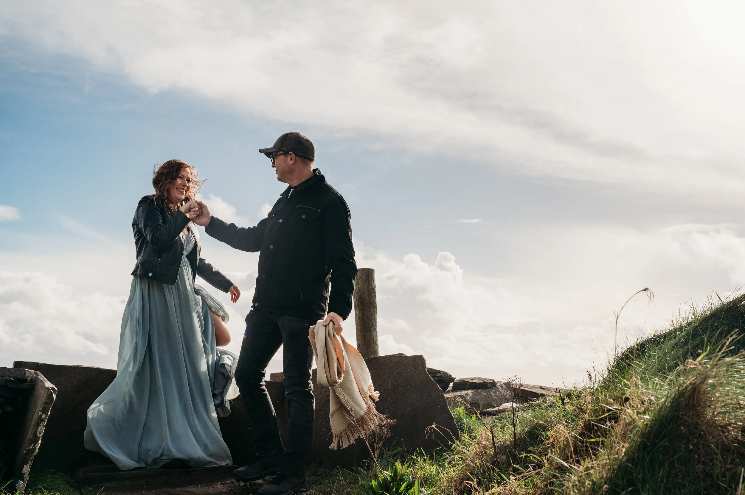 Marie O'Mahony photographer Cliffs of Moher anniversary couples photo session climbing over style at Hags Head