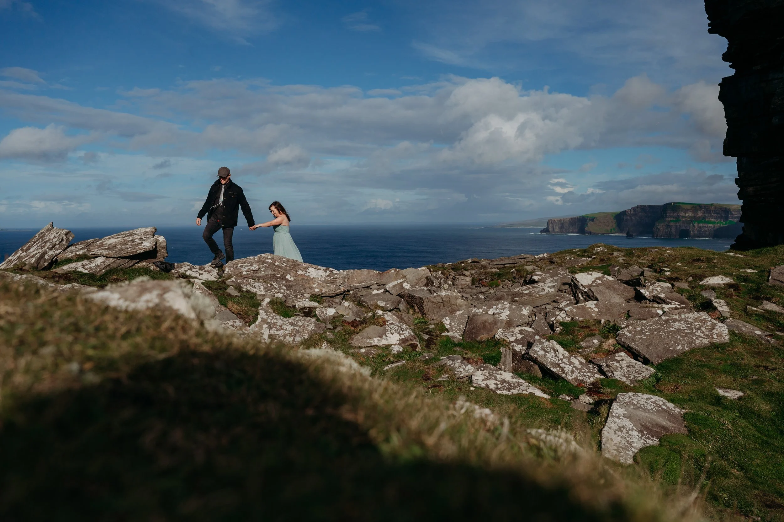 Marie O'Mahony photographer Cliffs of Moher anniversary couples photo session walking along the edge