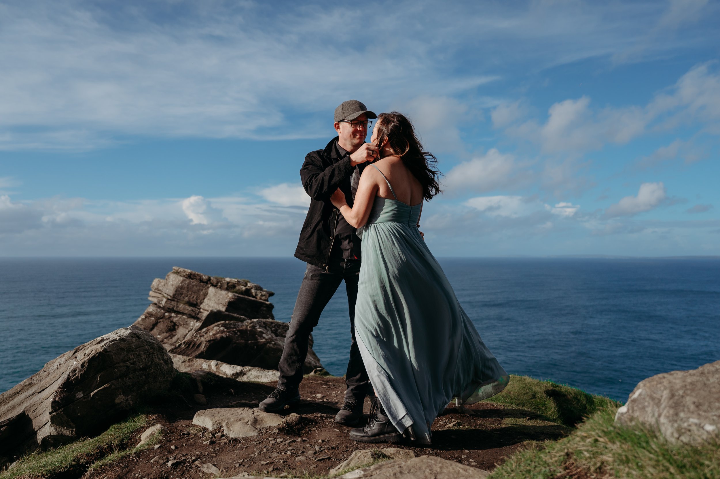 Marie O'Mahony photographer Cliffs of Moher anniversary couples photo session kissing at the top