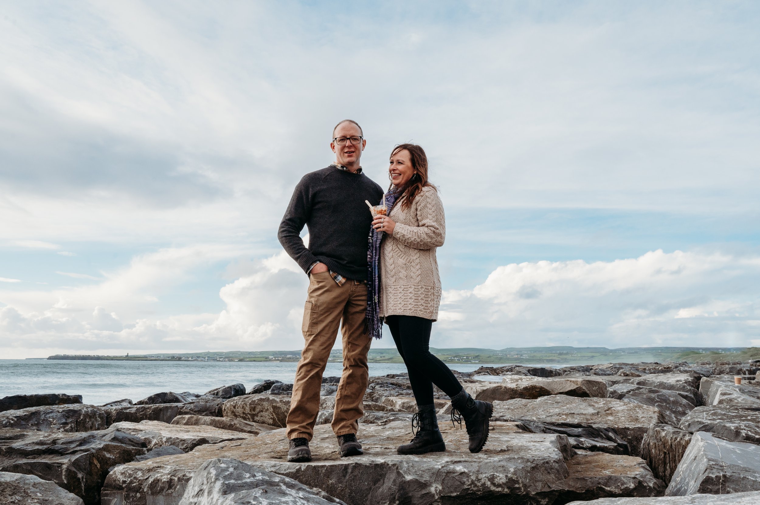 Marie O'Mahony photographer Lahinch anniversary couples photo session standing on rocks