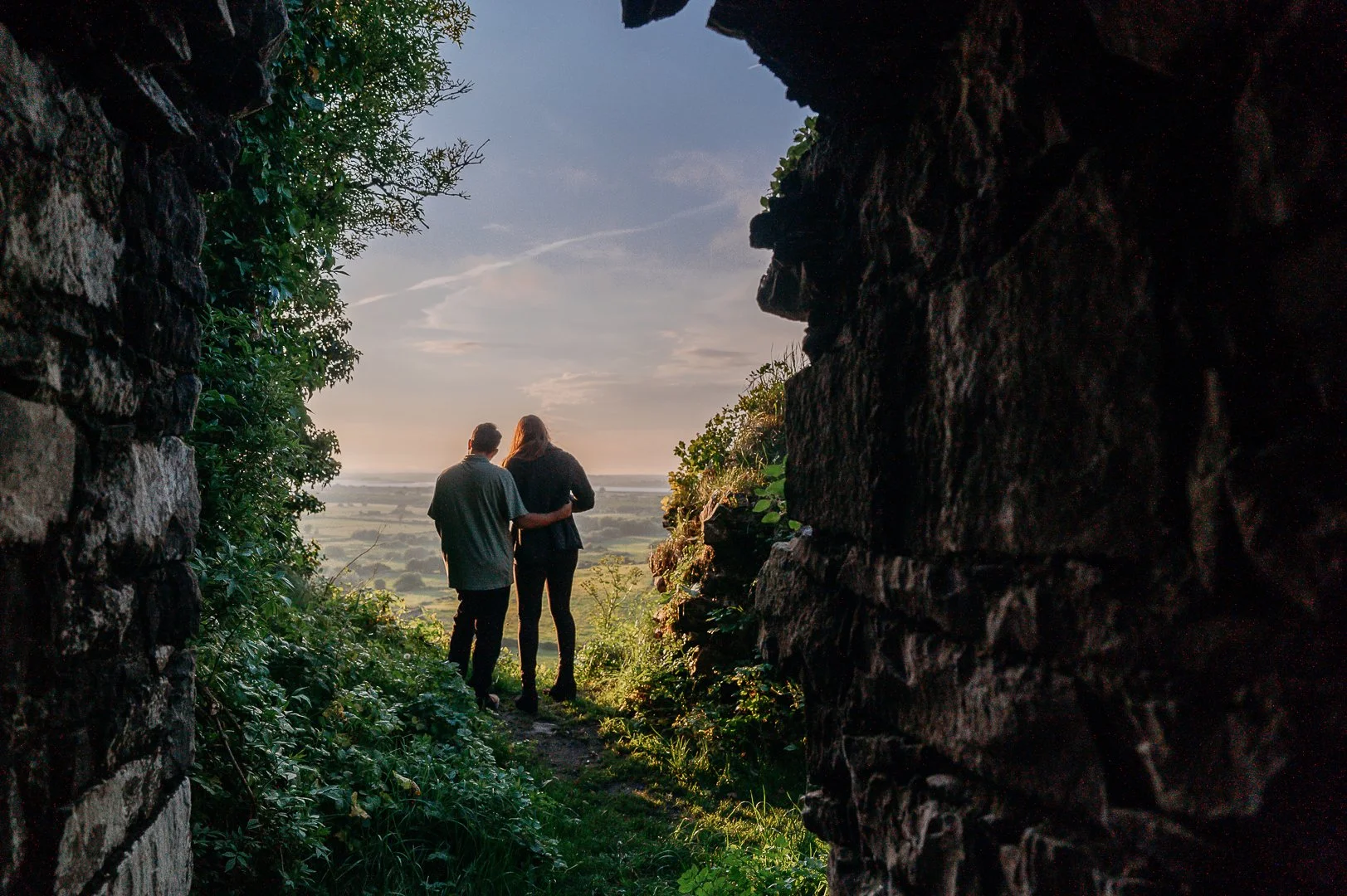 Carrigogunnel castle photo session Ireland Marie O'Mahony photography couple looking at sunset