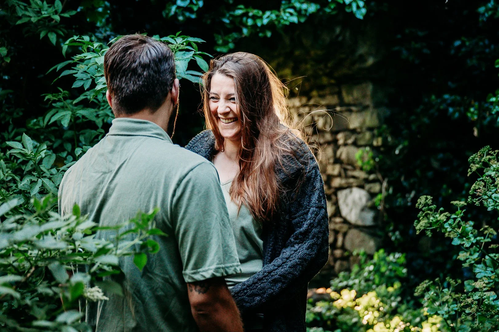 Carrigogunnel castle photo session Ireland Marie O'Mahony photography couple holding hands in front of castle wall