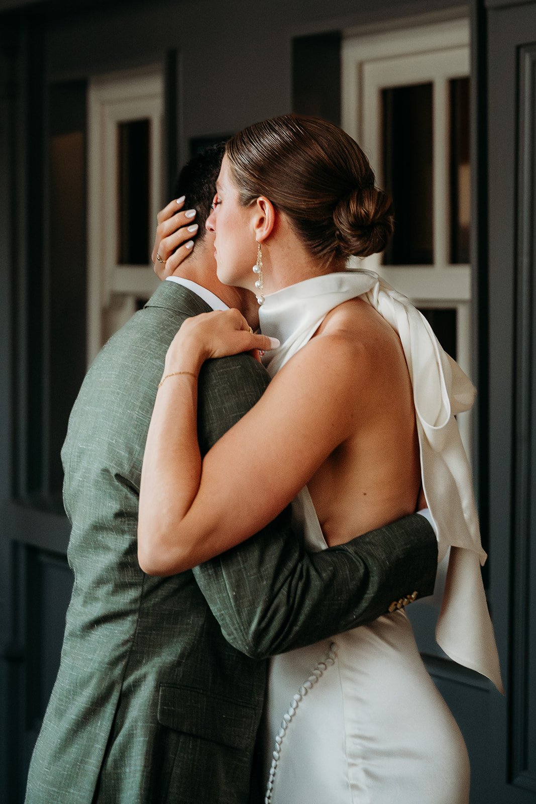 Galway Bay Hotel wedding photos first look wedding couple hugging