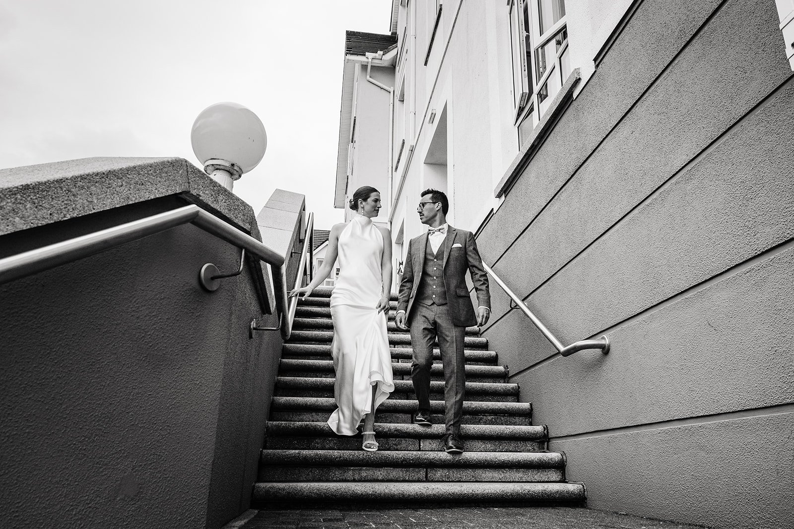 Galway Bay Hotel wedding photos couple walking down stairs black and white image