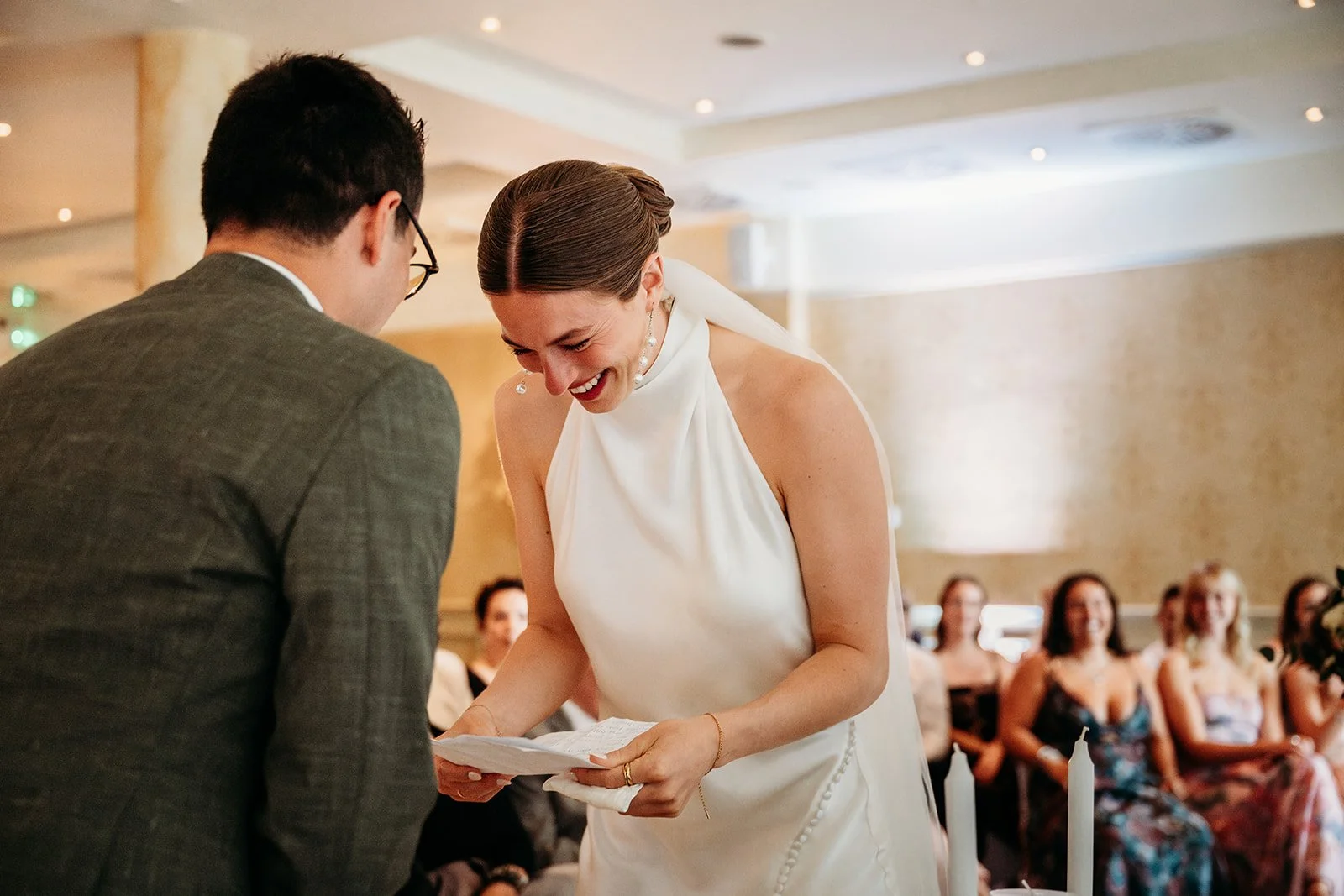 Galway Bay Hotel wedding photos couple saying vows bride leaned over laughing