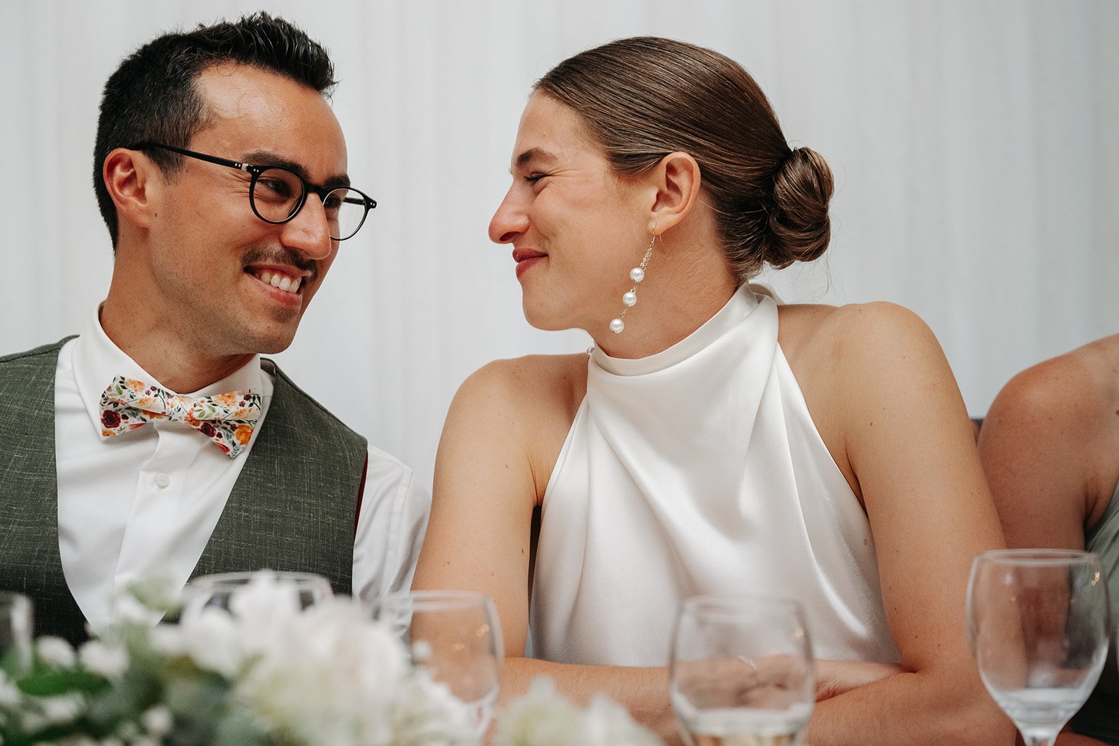 Galway Bay Hotel wedding photos bride and groom smiling at each other during speeches