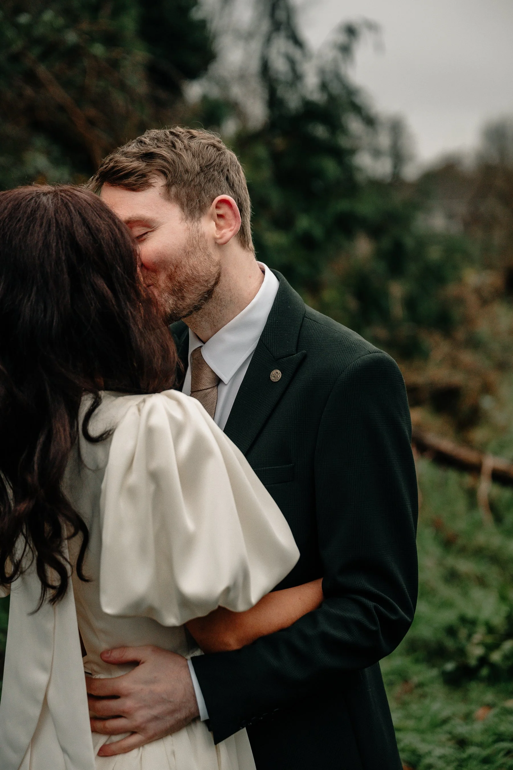 Limerick wedding photos couple's photo man kissing woman outside near the Shannon river