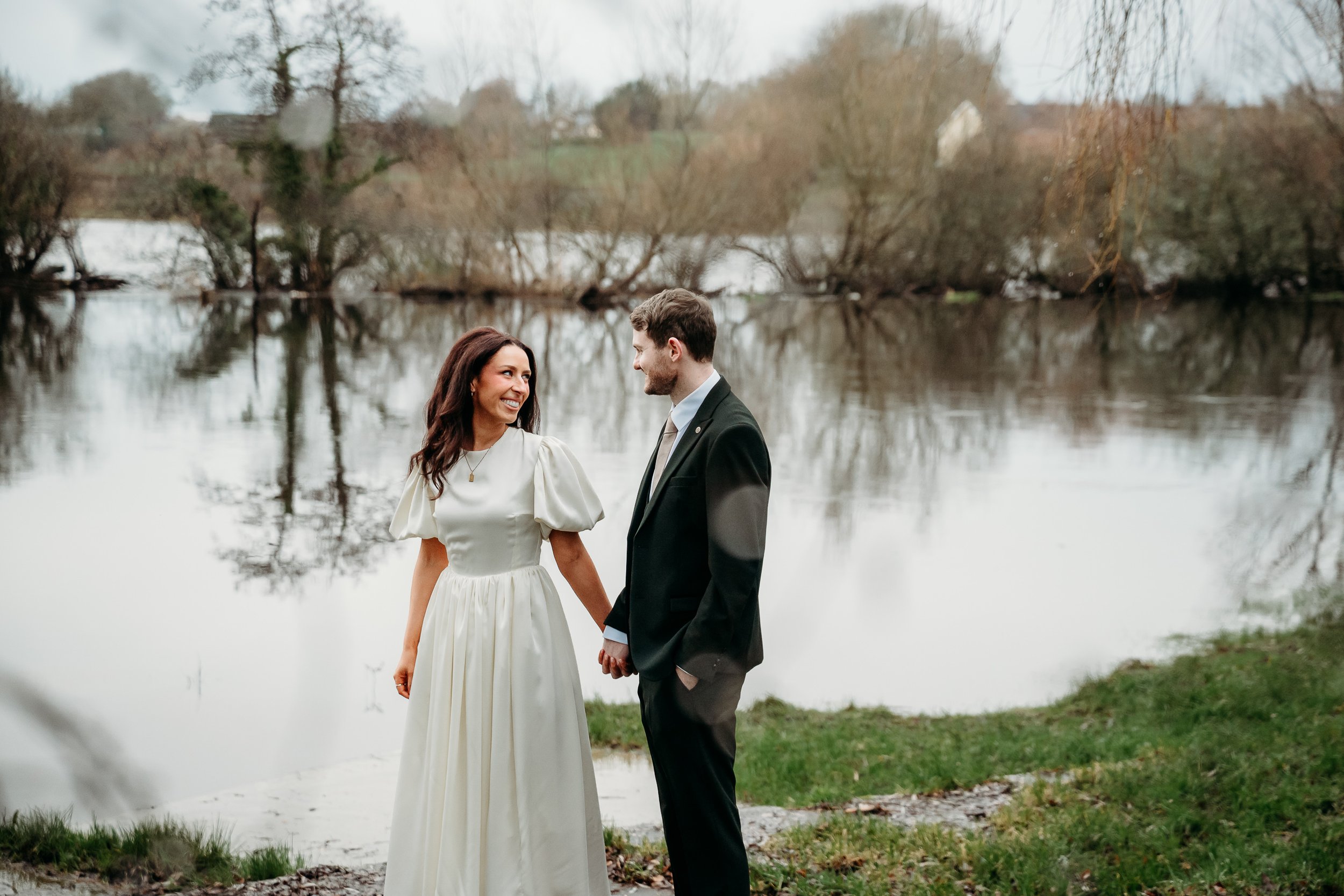 Limerick wedding photos couple's photos laughing and walking together near Shannon river