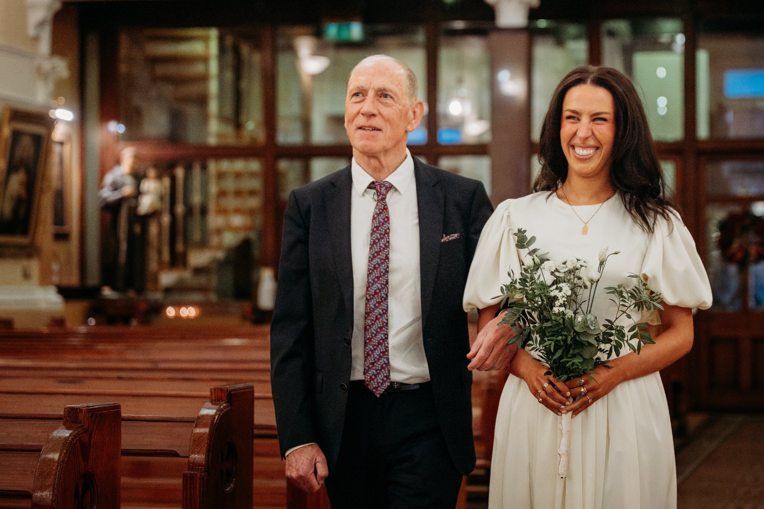 Wedding photo St Joseph's church Limerick city bride and father walking down the aisle
