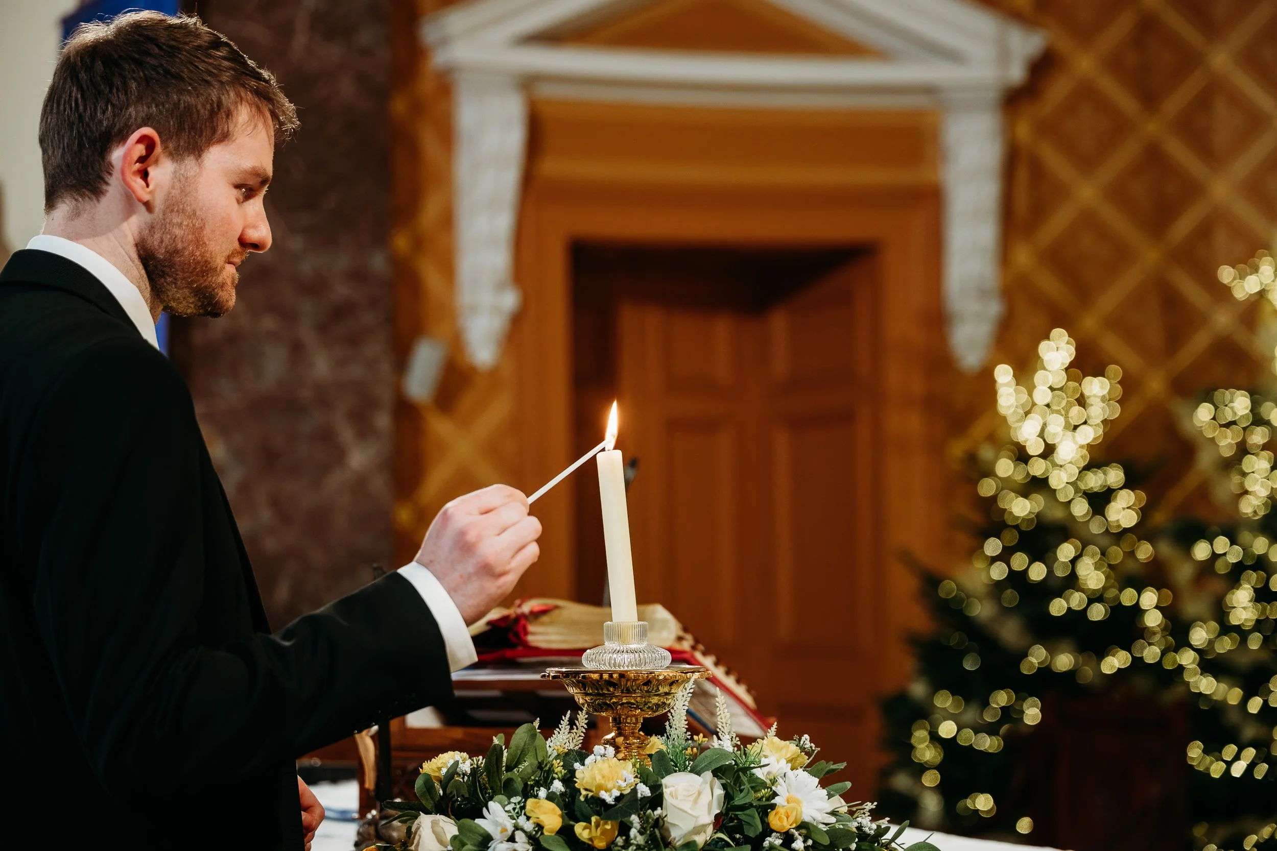 Wedding photo St Joseph's church Limerick city groom lighting candle