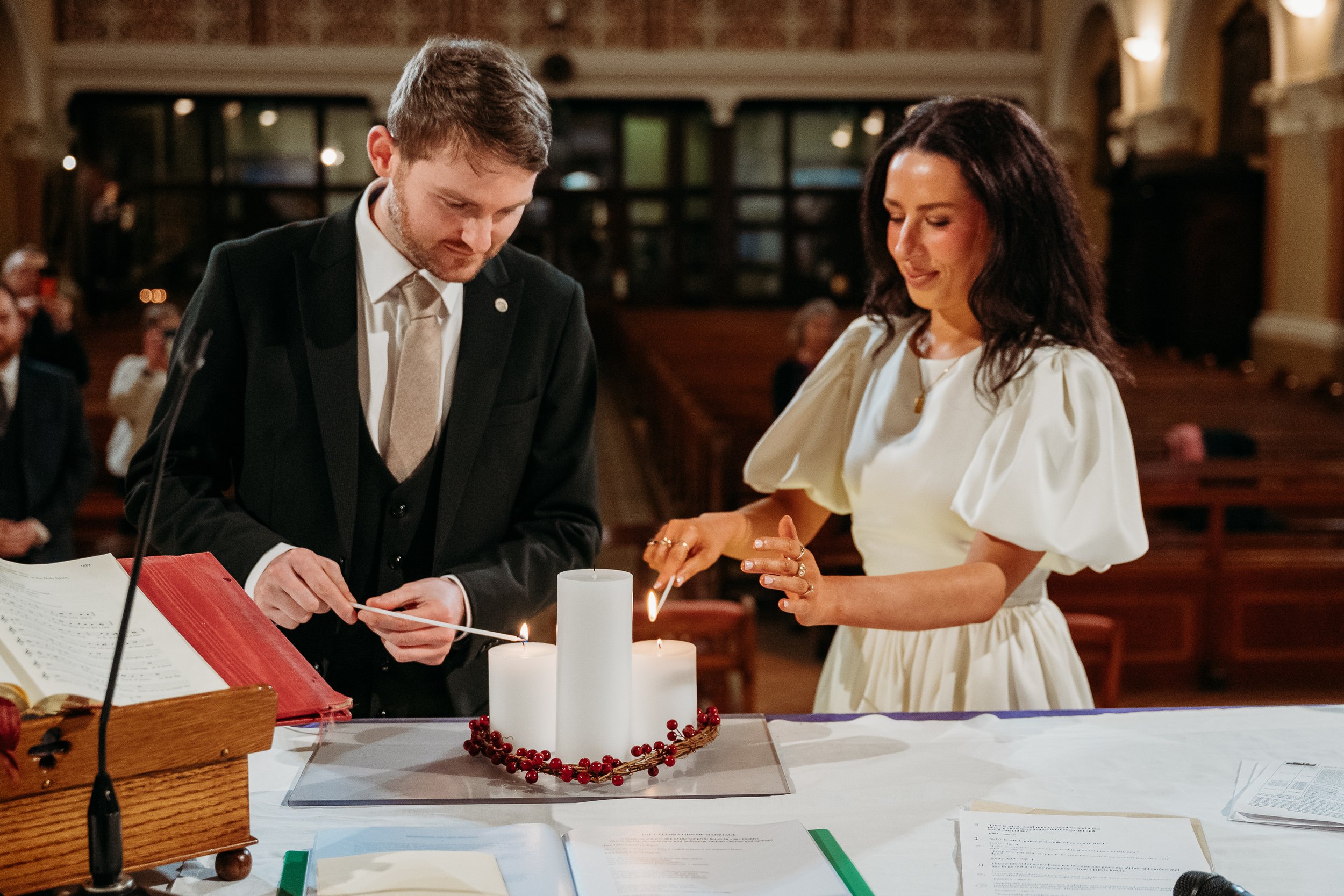 Wedding photo St Joseph's church Limerick city bride and groom lighting candle
