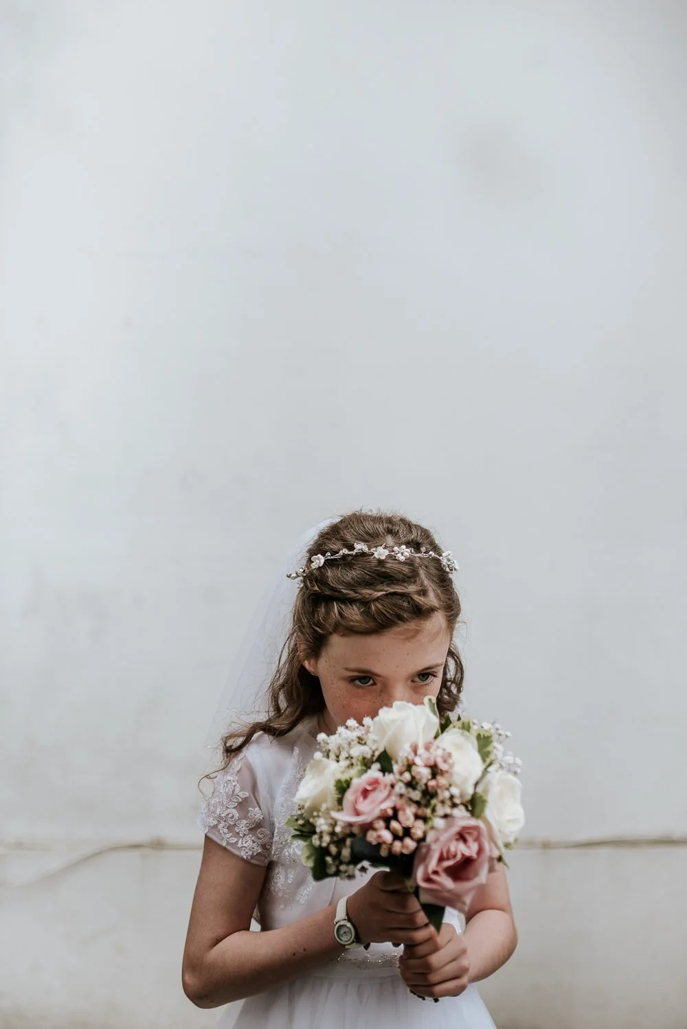 communion girl smelling flowers.jpg