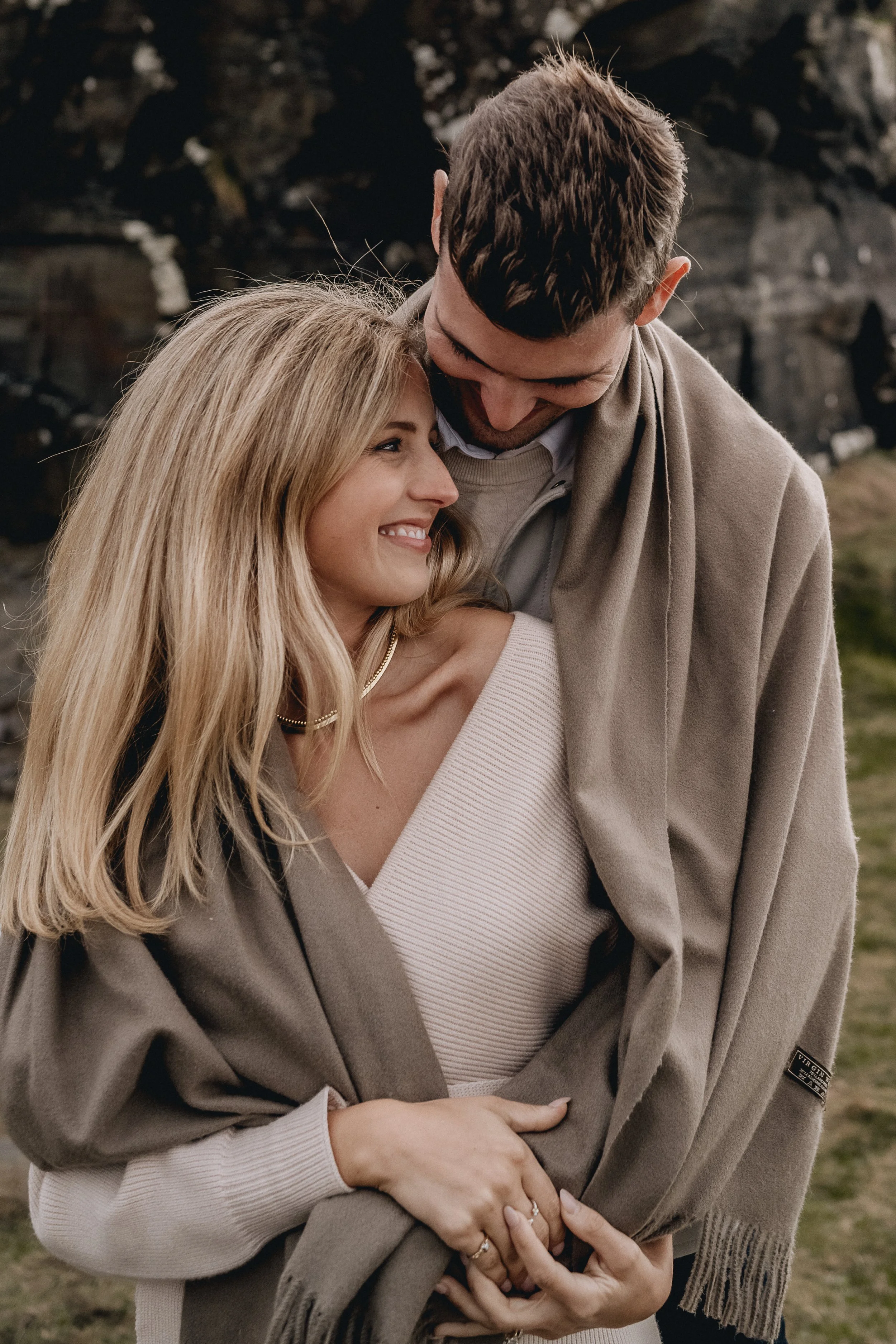 Close up of couple with brown blanket around shoulders cliffs of moher maternity photos couple session 