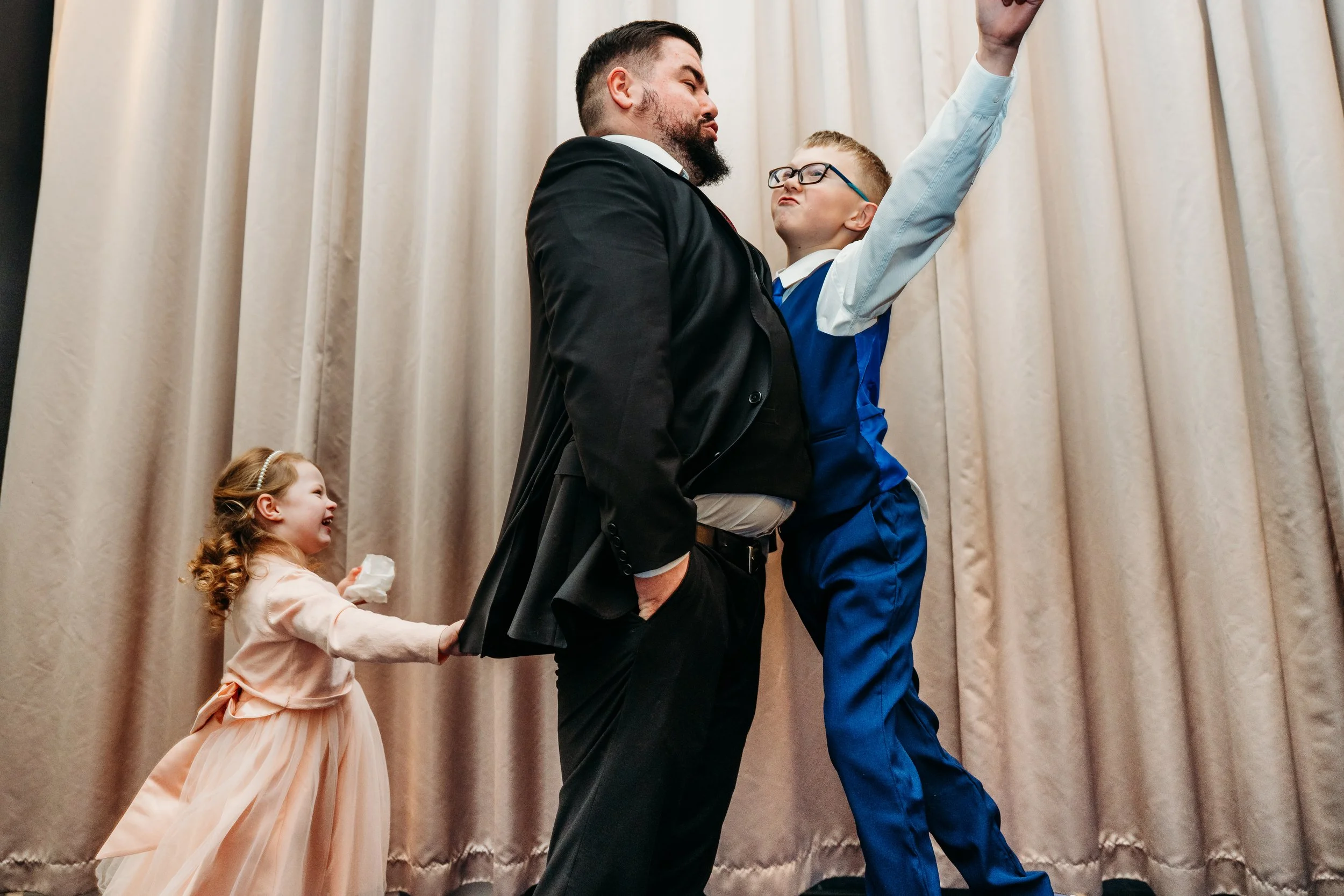 children playing with uncle at wedding reportage wedding photography candid moment ireland