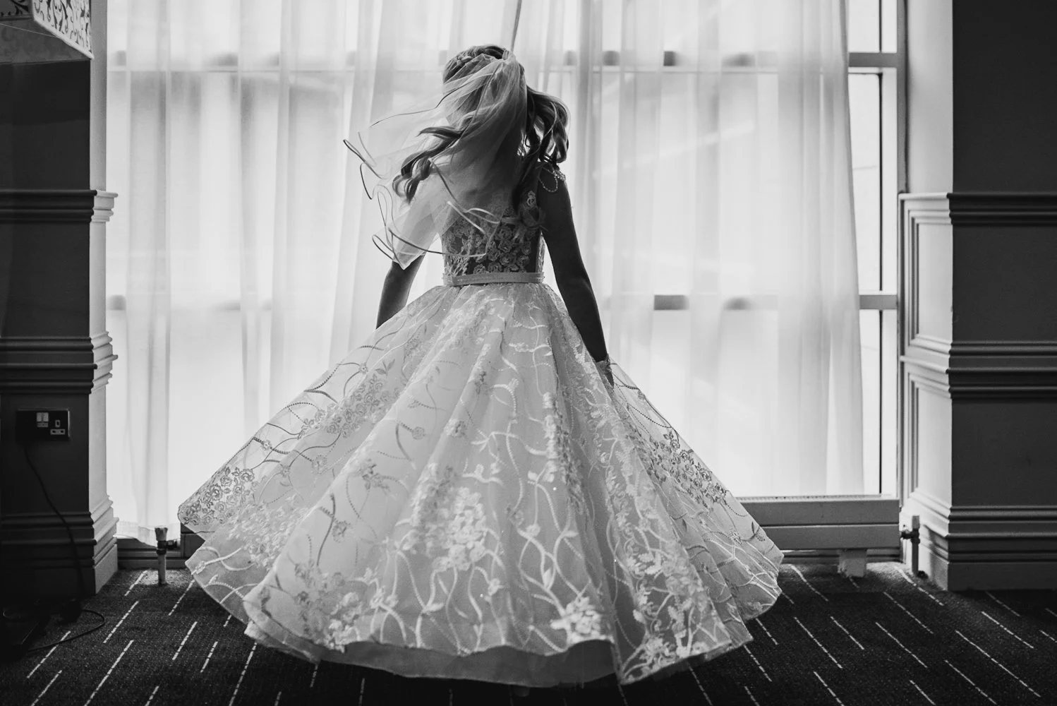 communion girl spinning in front of window.jpg