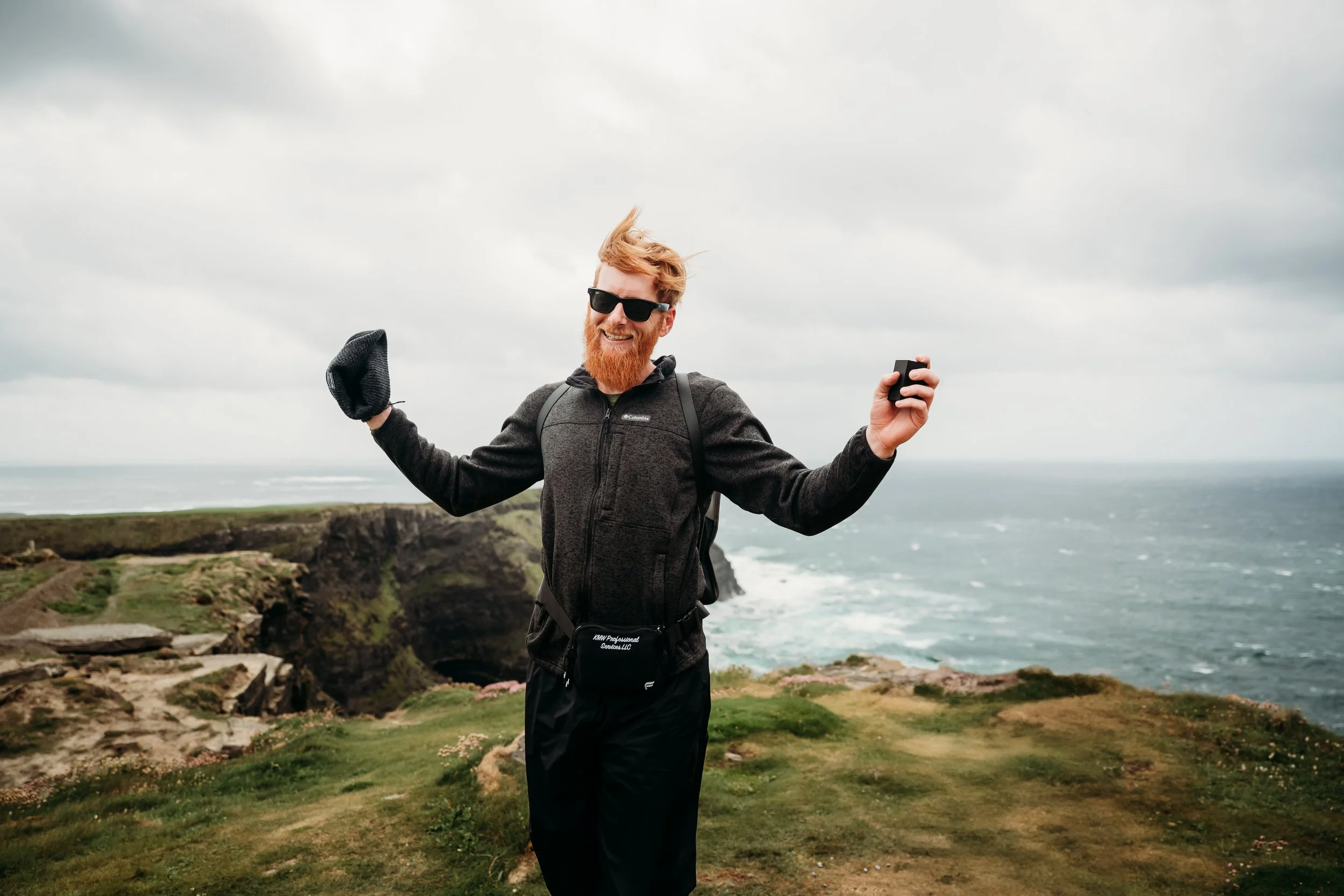 man very happy after proposal at the Cliffs of Moher Hags Liscannor proposal photographer Ireland Co Clare