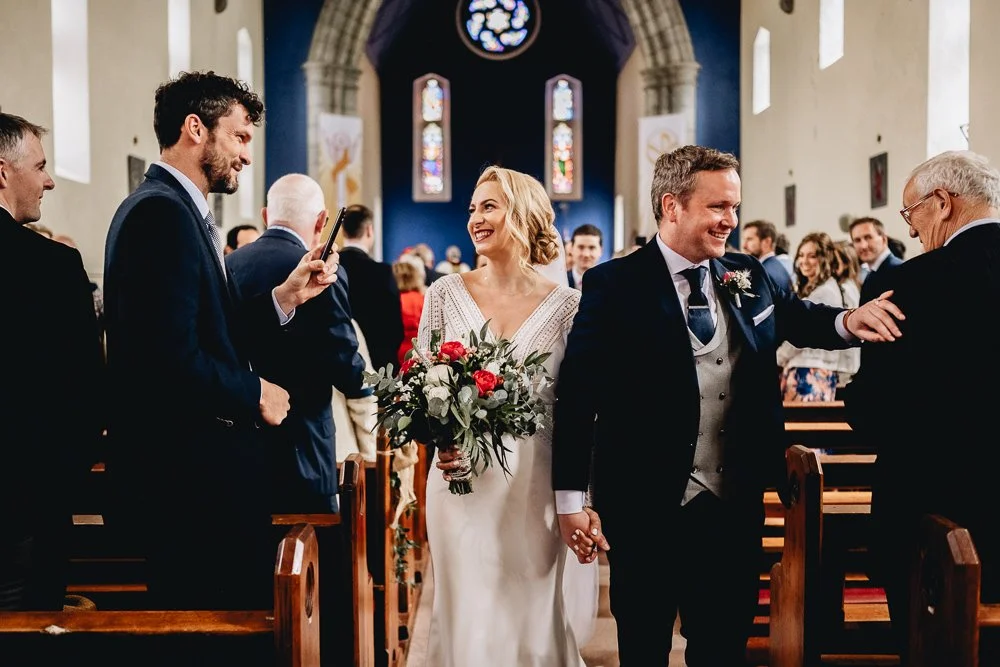 bride and groom walking down aisle Limerick wedding photographer